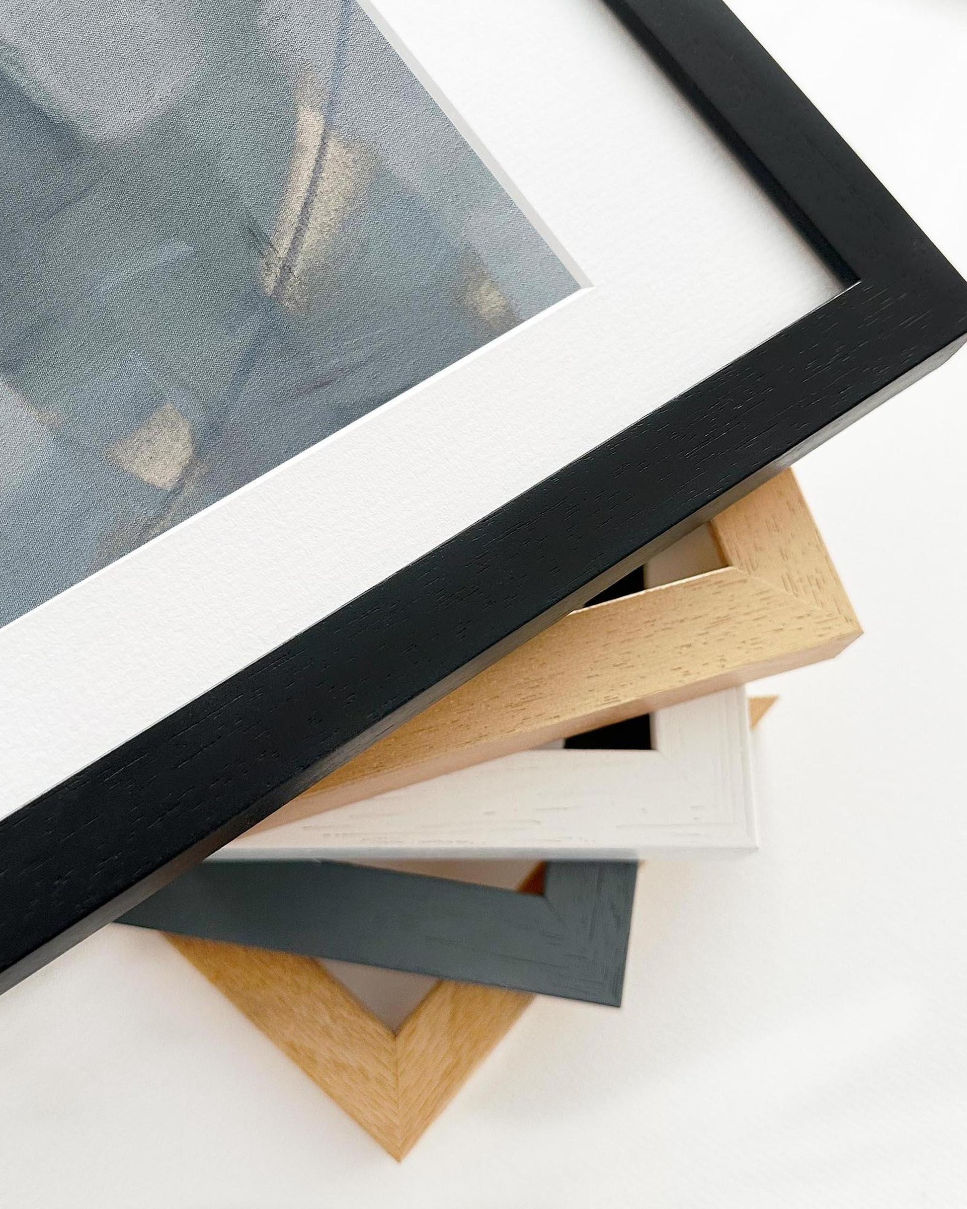 Collection of various photo frames on a white surface