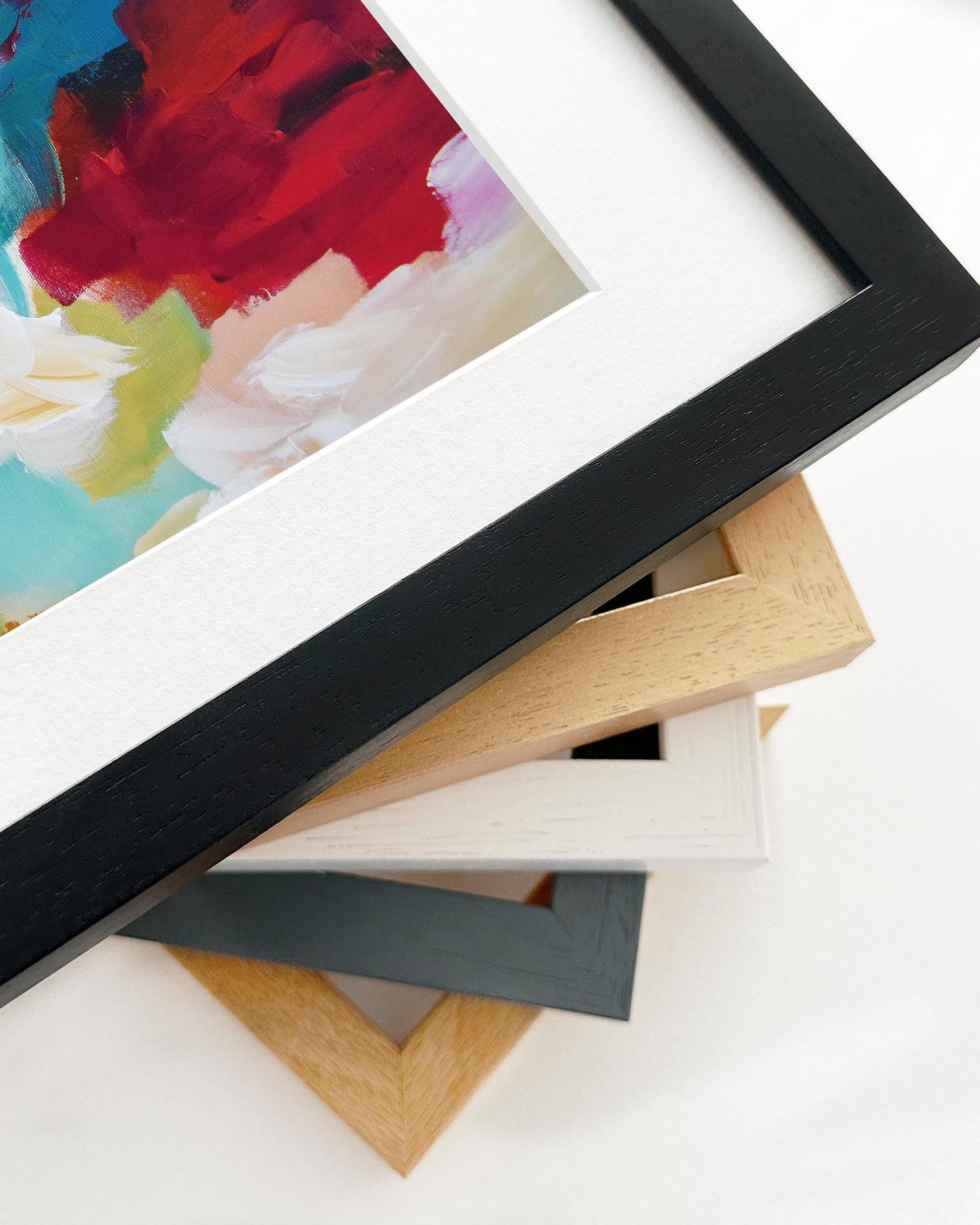 Stack of various picture frames on a white background