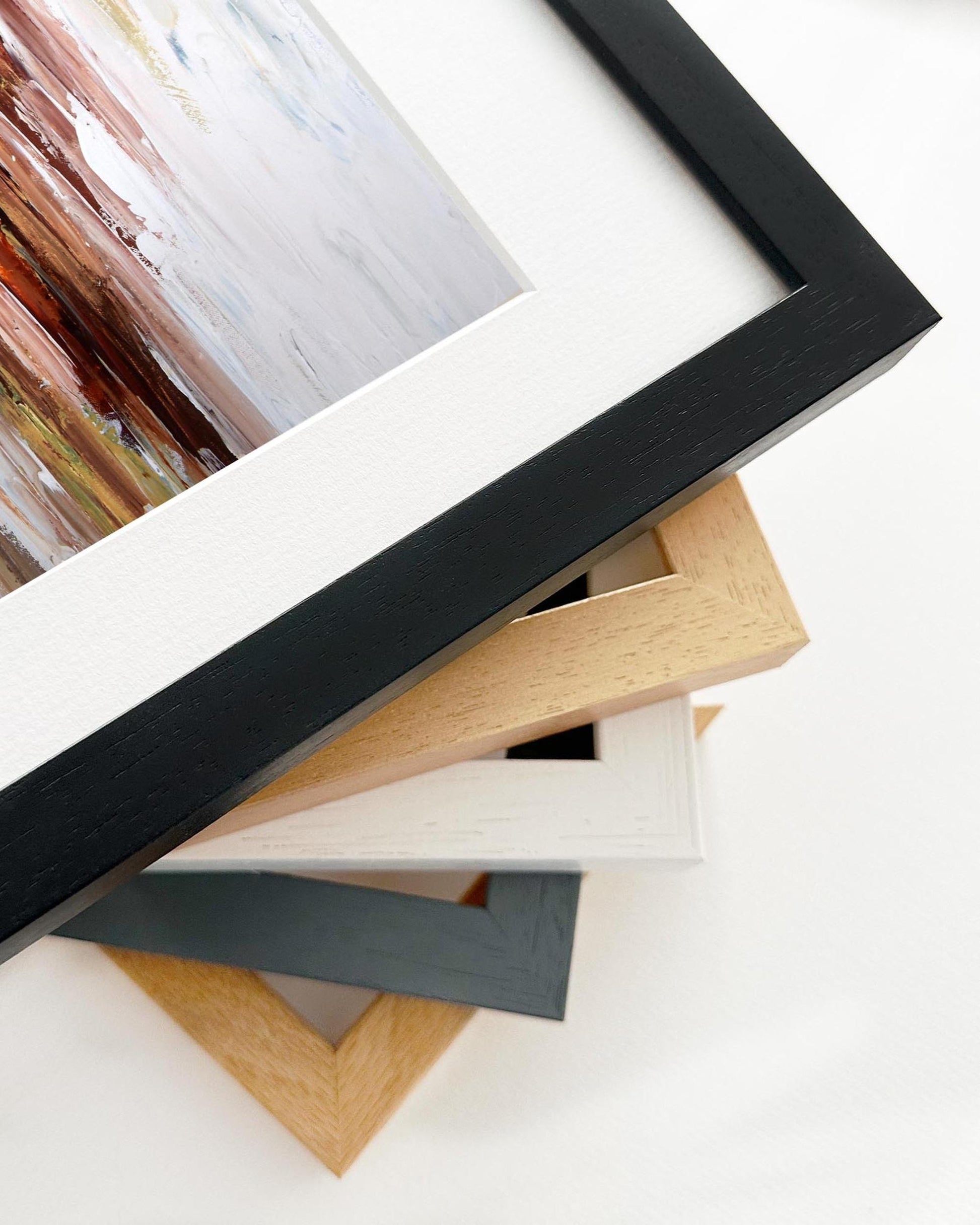 Stack of various photo frames on a white background
