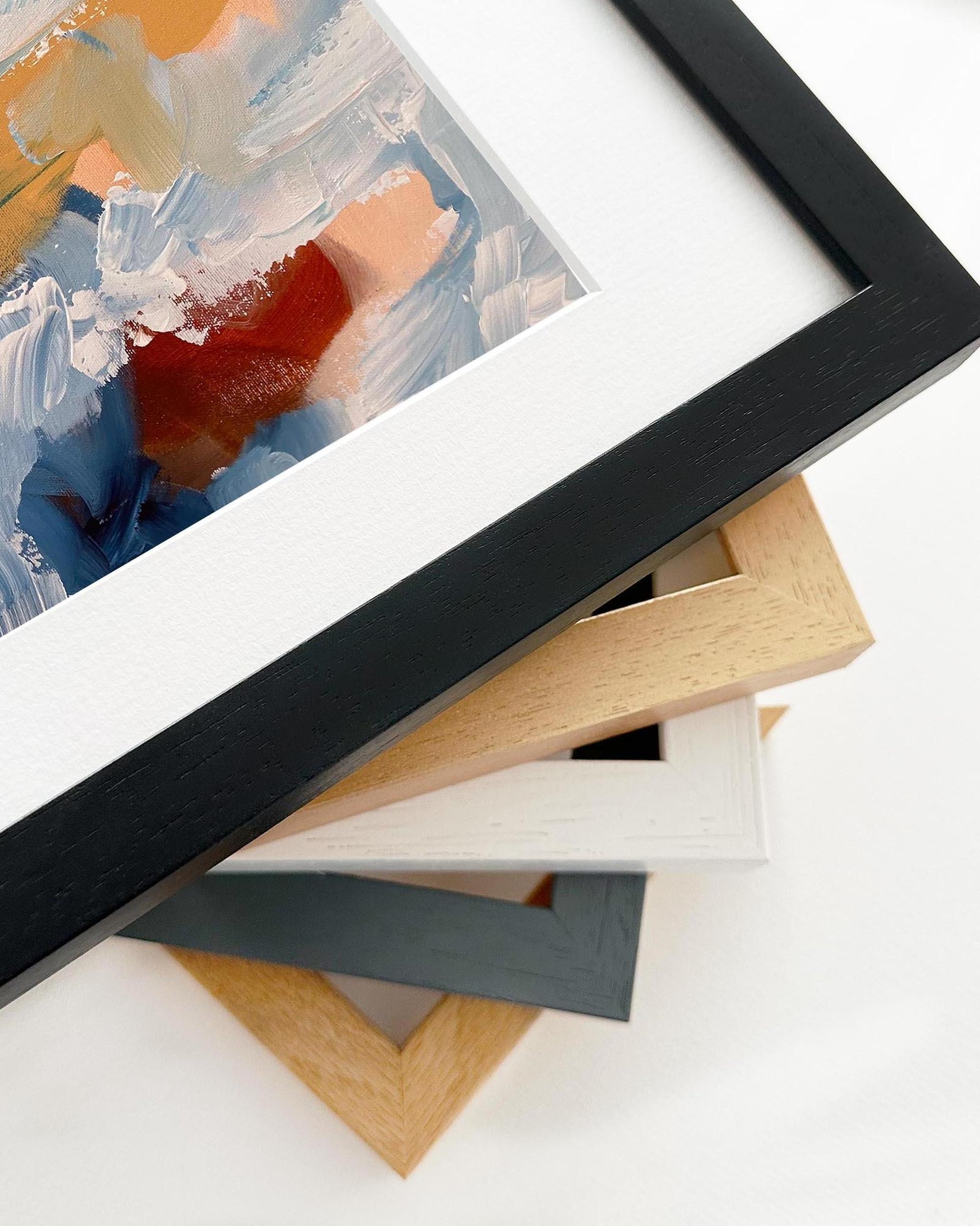 Stack of various picture frames on a white background