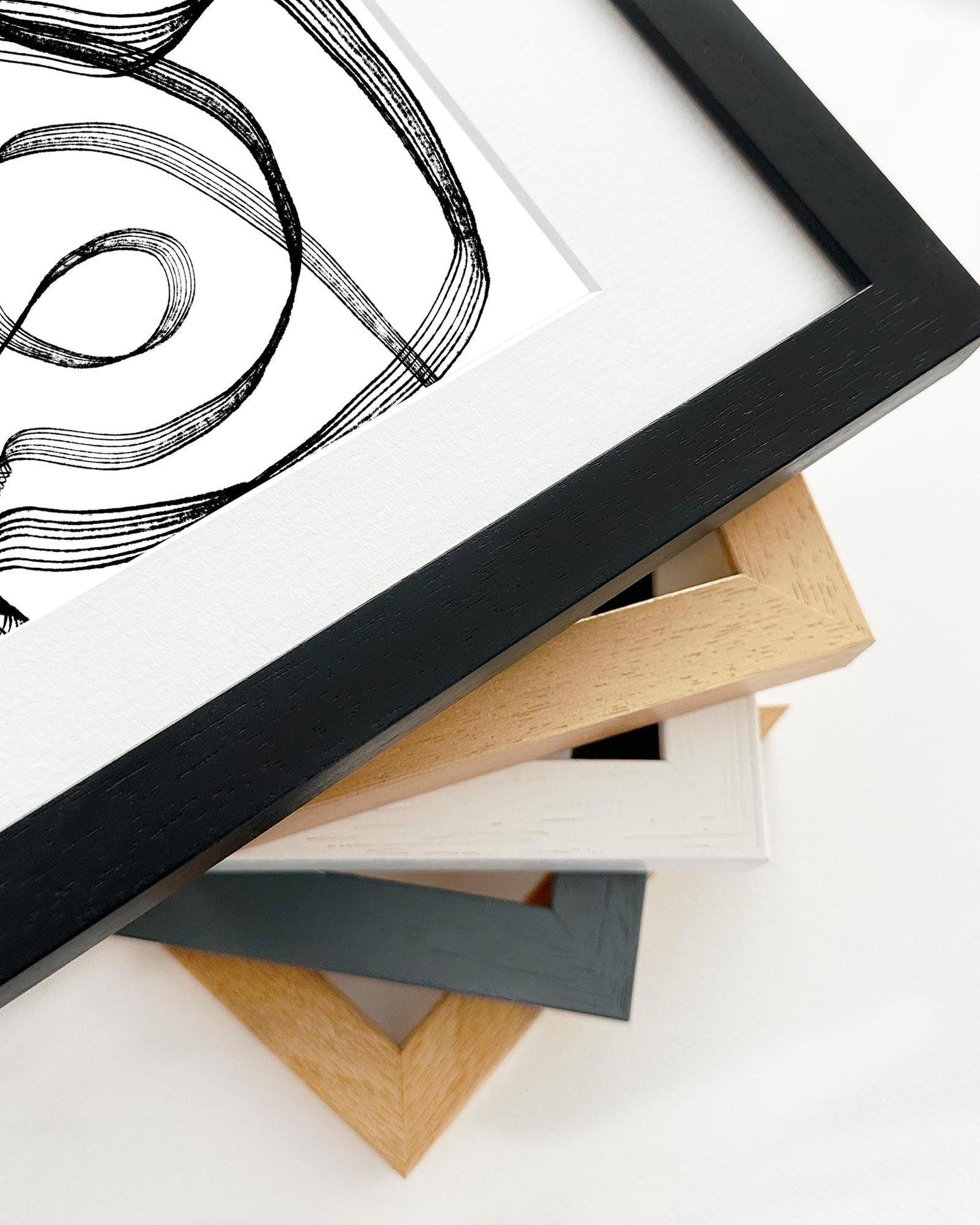 Framed artwork with a black frame on a white background