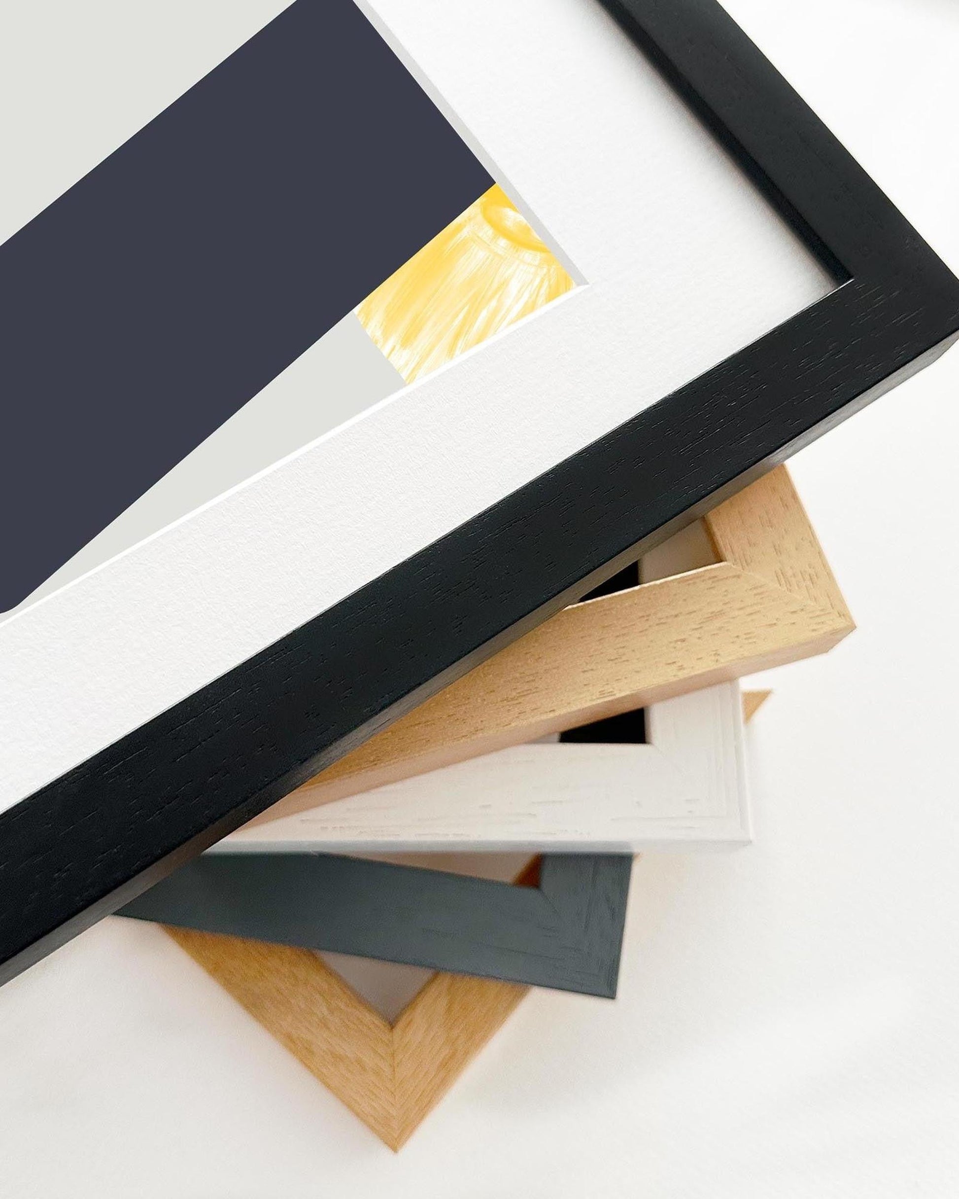 Stack of various photo frames on a white background