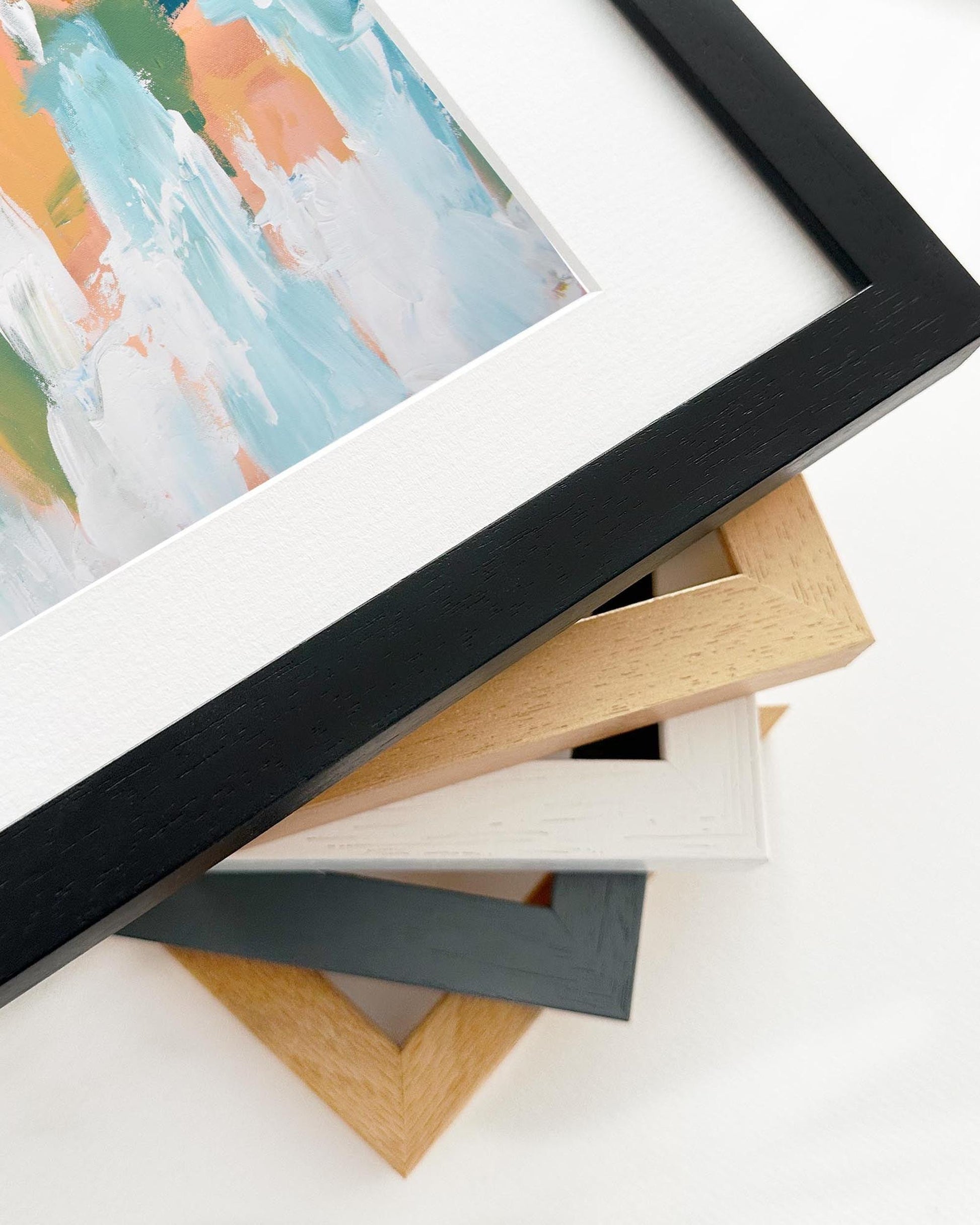 Collection of various photo frames on a white surface