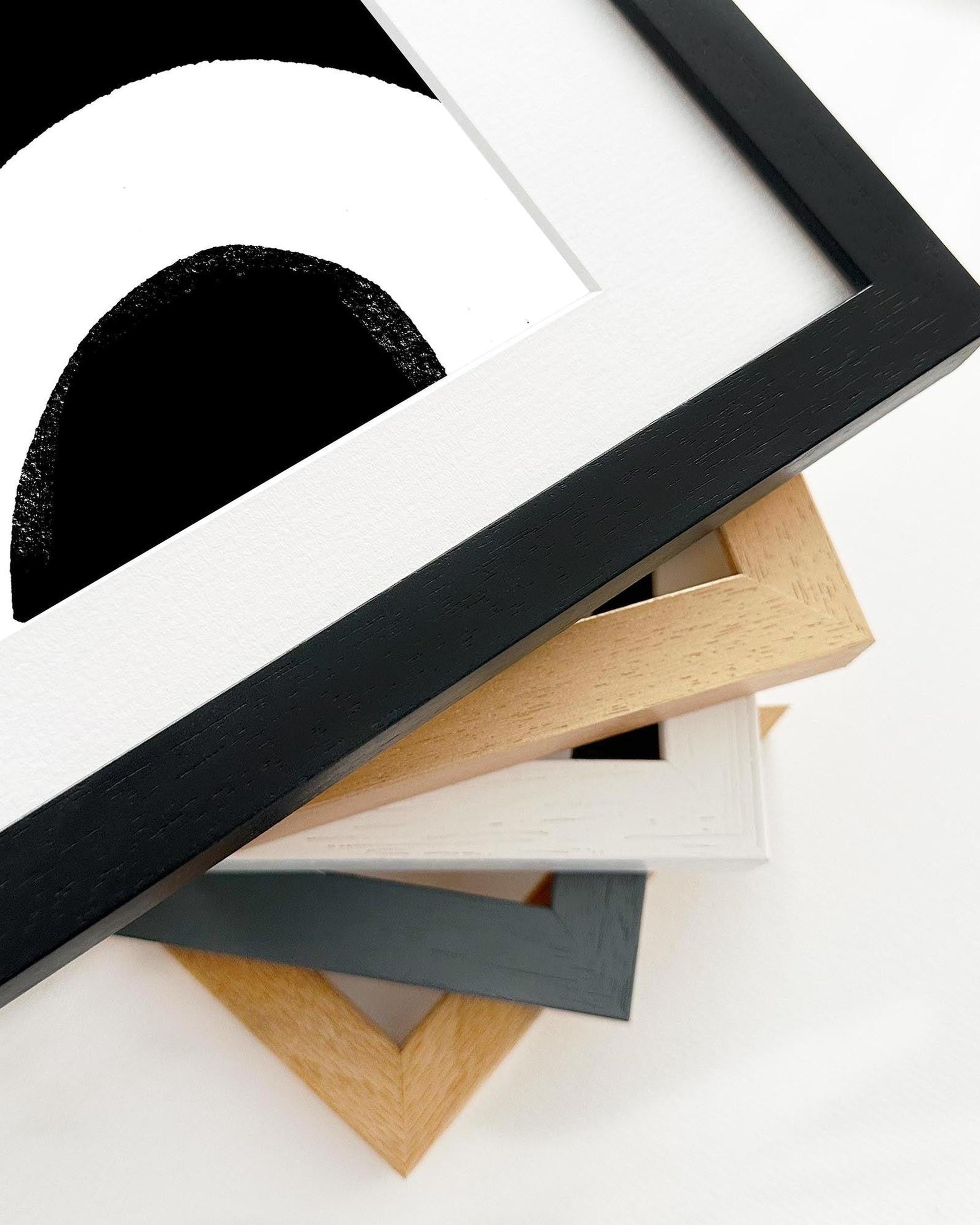 Collection of variously shaped and colored picture frames on a white background
