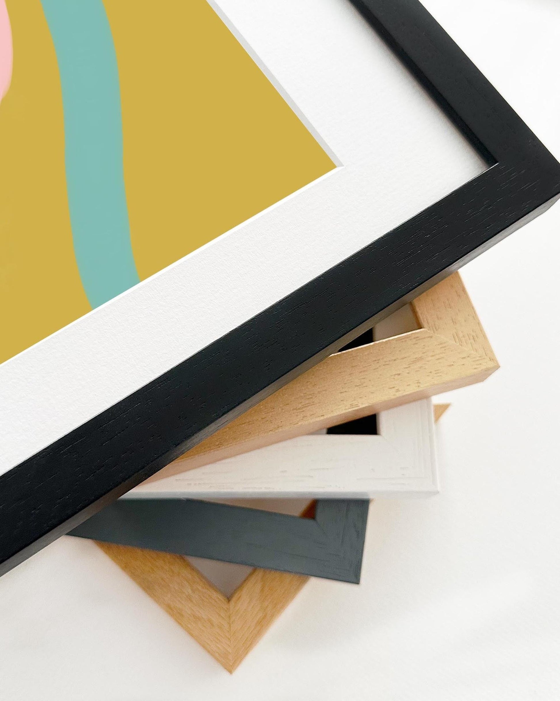 Collection of different colored picture frames on a white background