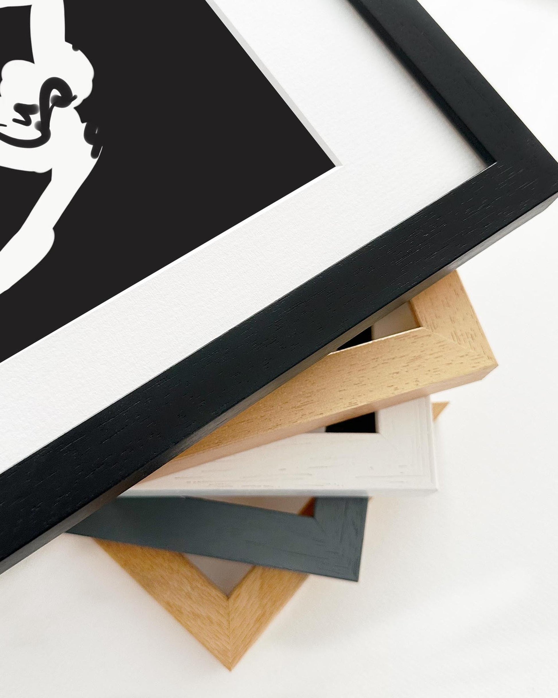 Collection of various wooden picture frames on a white background