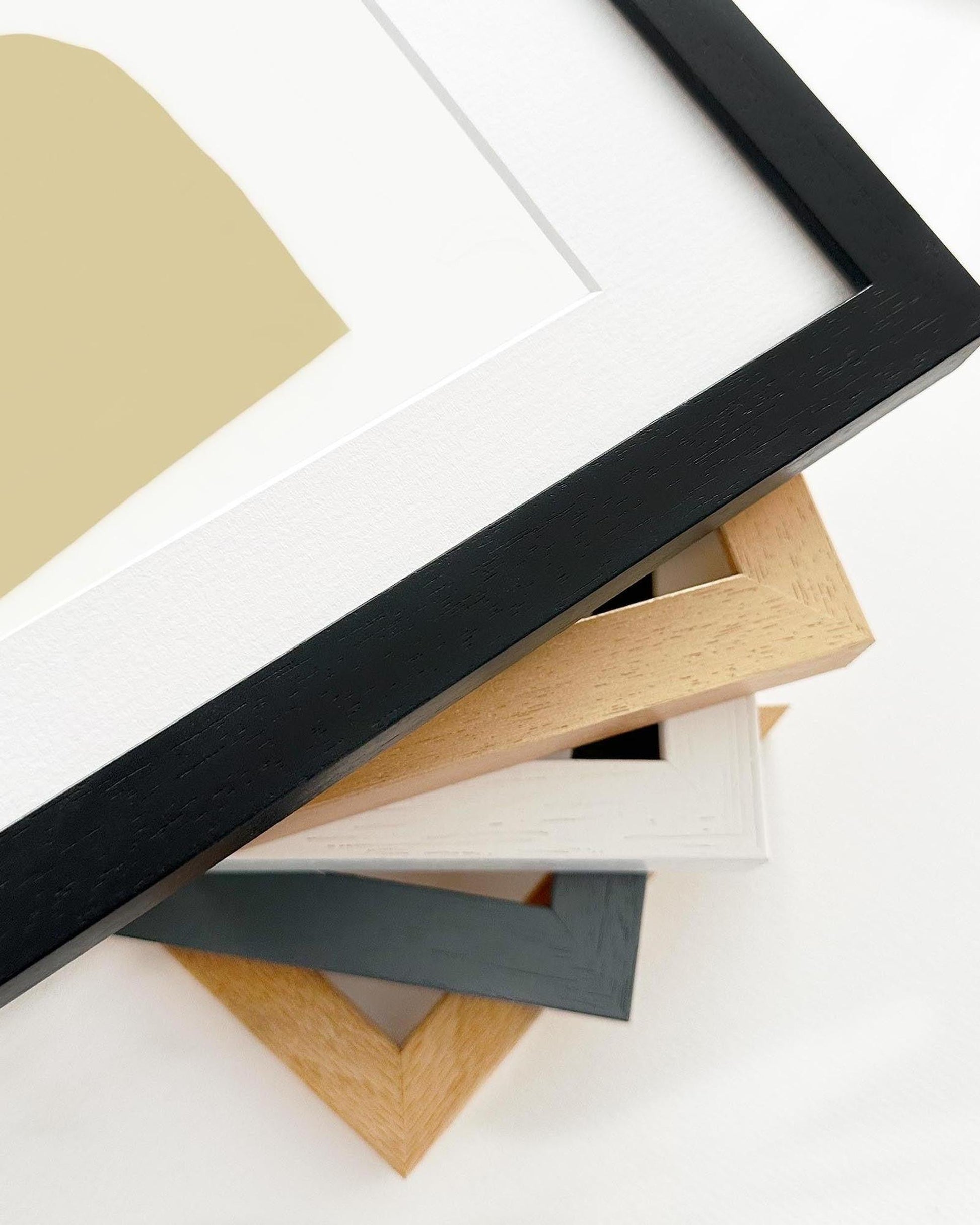 Collection of various wooden picture frames on a white background