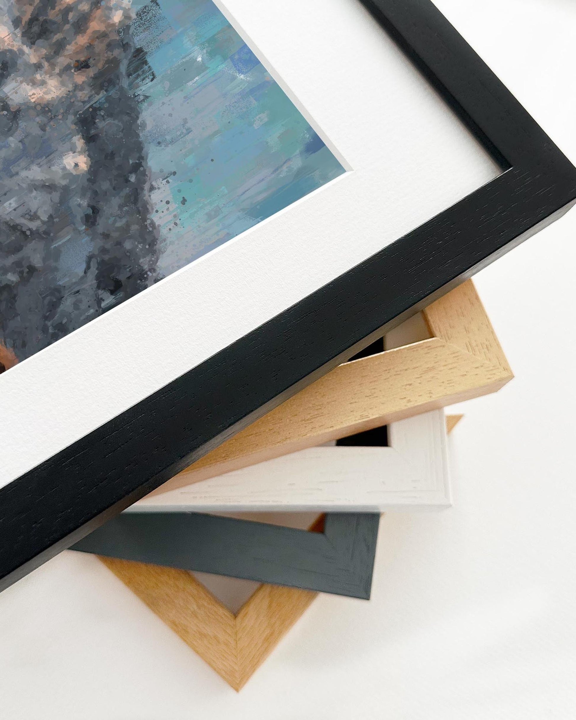 Stack of various picture frames on a white surface