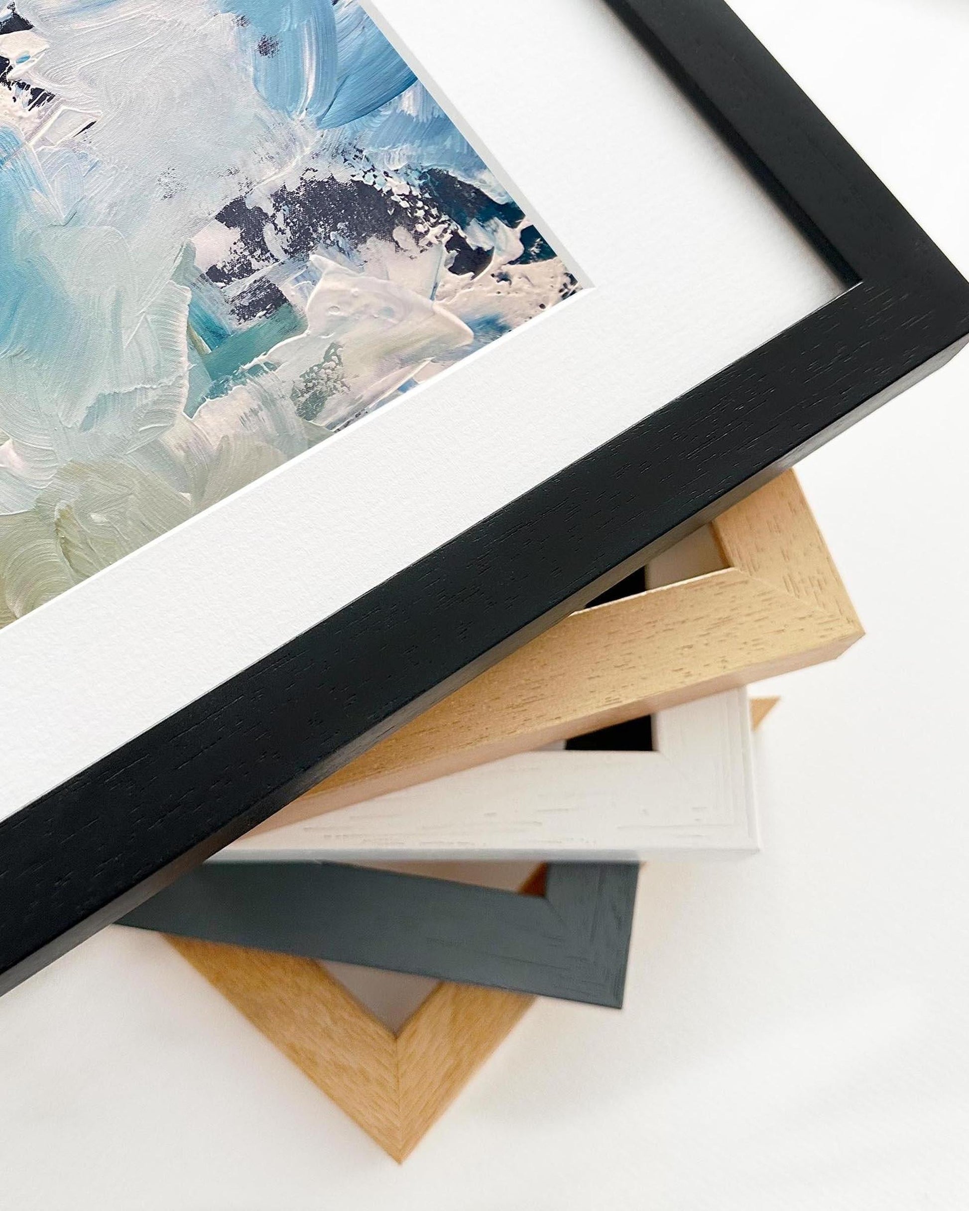 Collection of various photo frames on a white surface