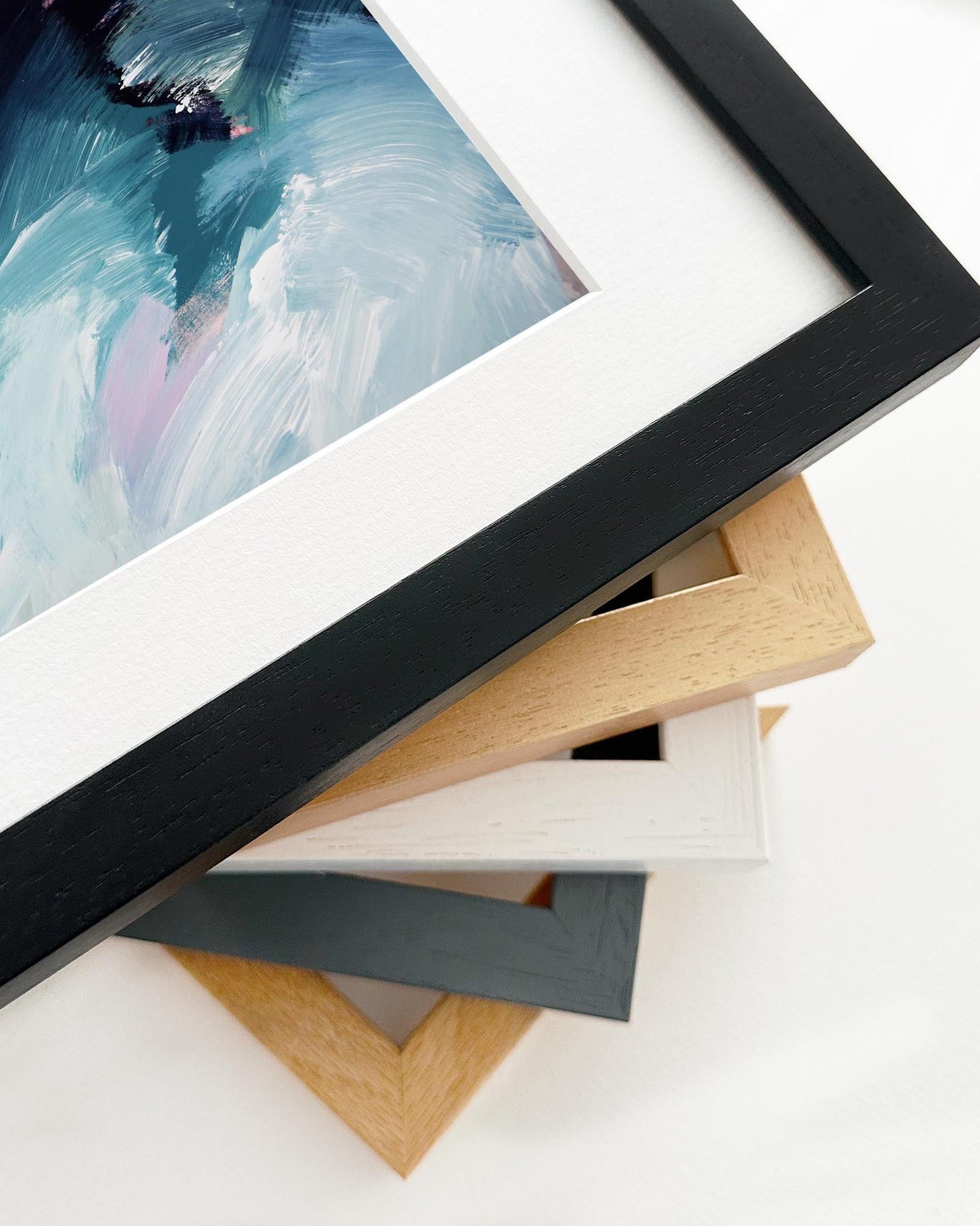 Collection of various picture frames on a white surface
