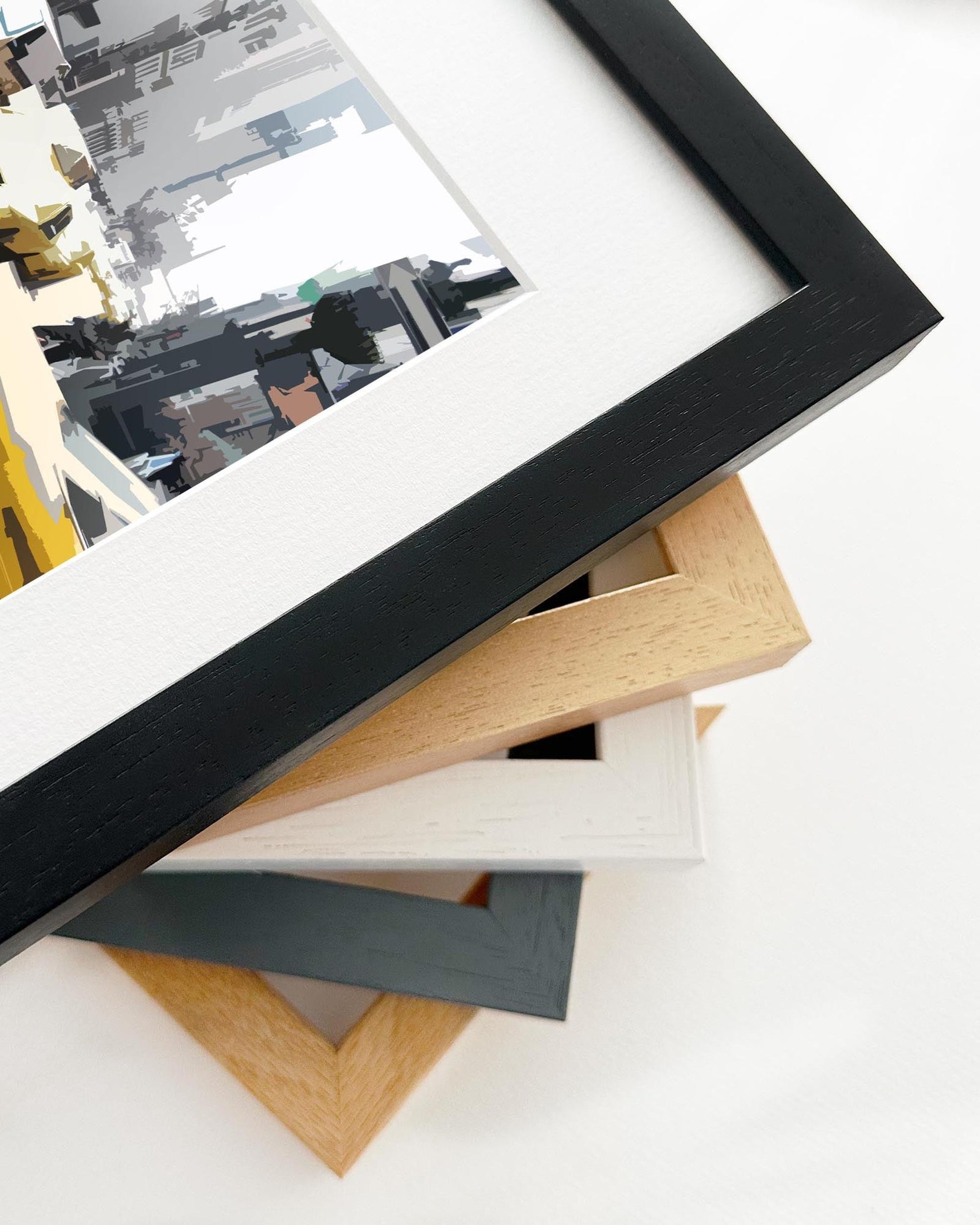 Stack of various photo frames on a white surface