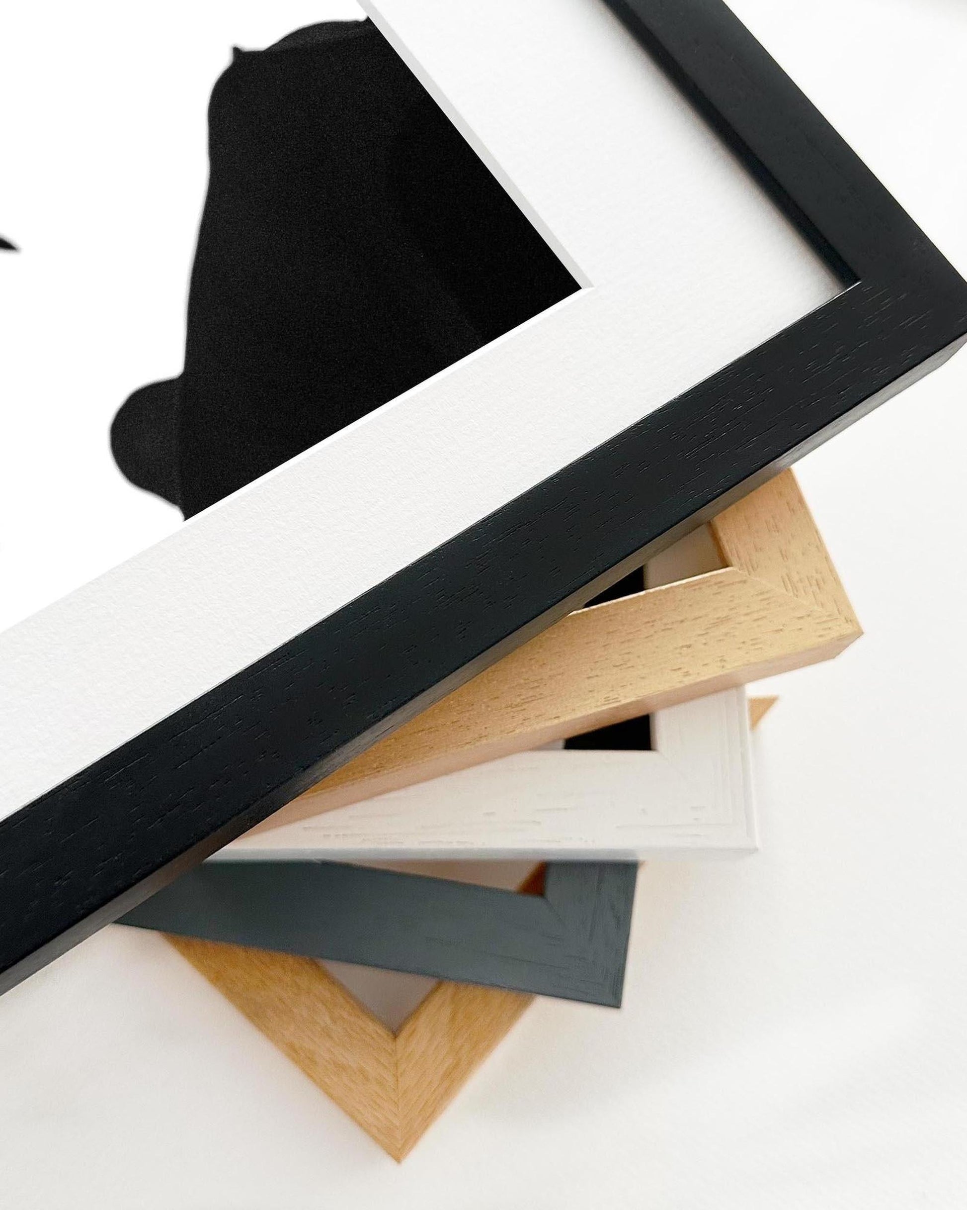 Stack of various photo frames on a white background
