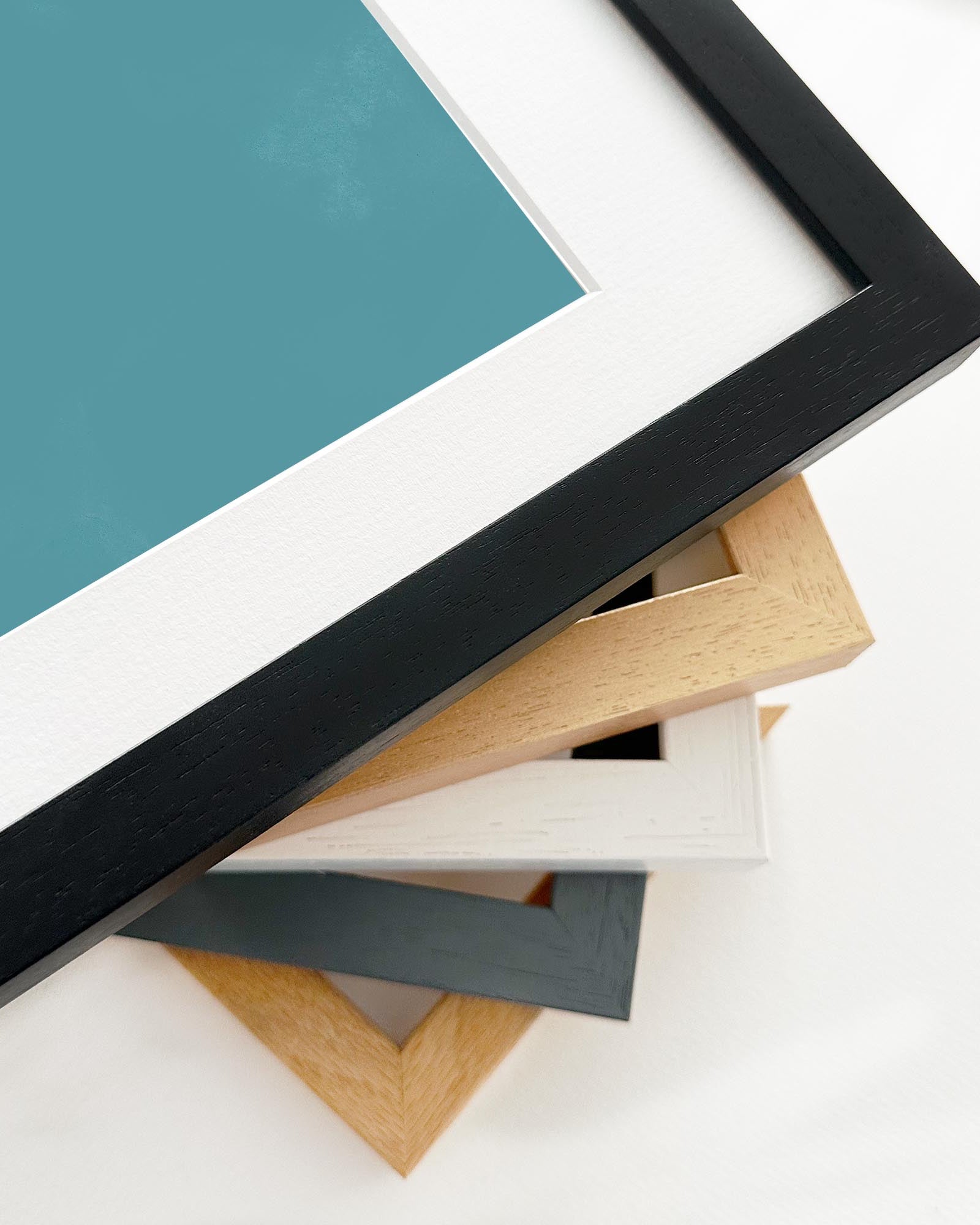 Stack of various picture frames on a white background