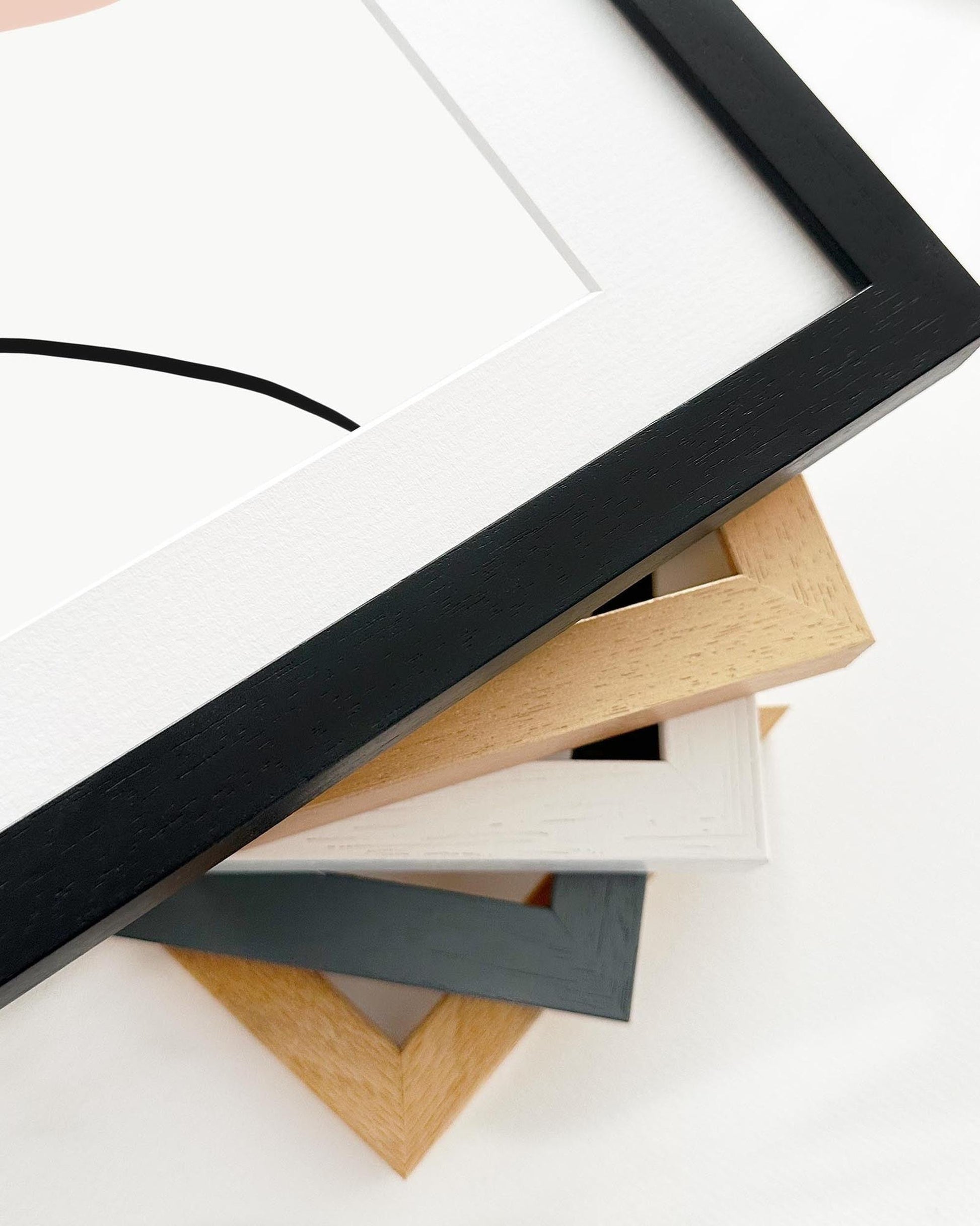 Collection of various wooden picture frames on a white background