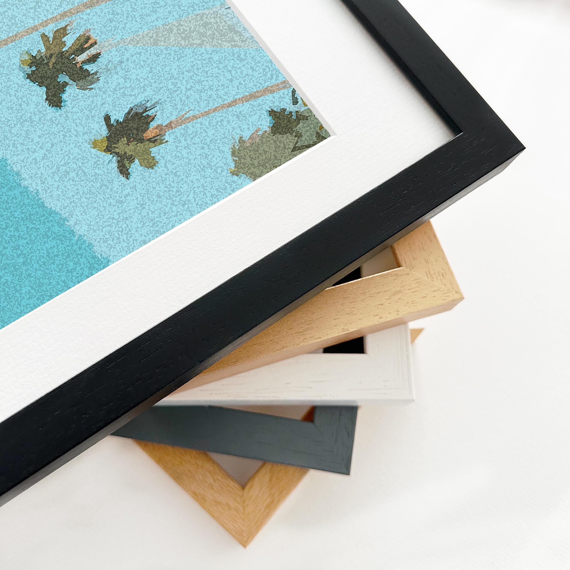 Stack of variously colored picture frames on a white surface