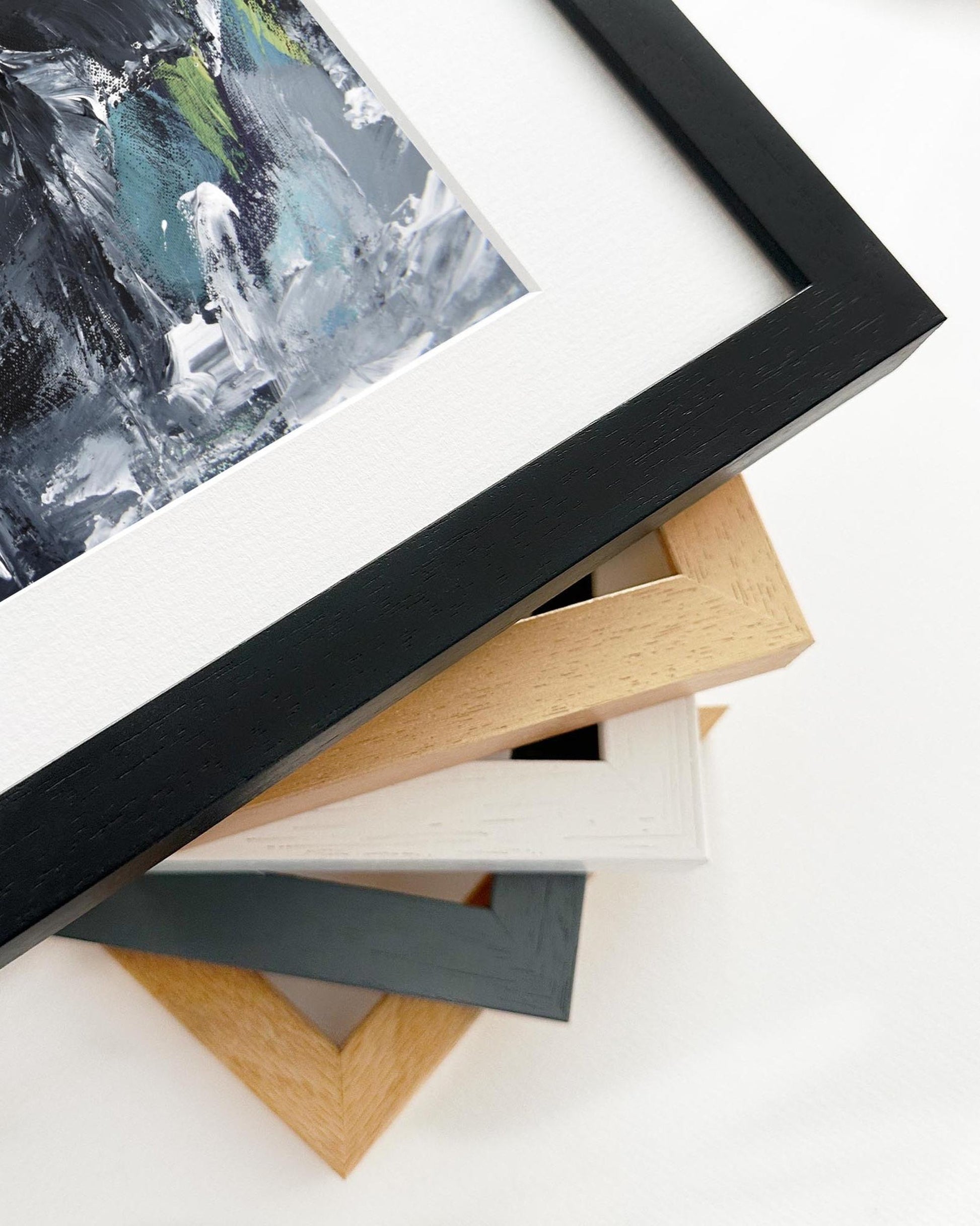 Close-up of various picture frames on a white surface