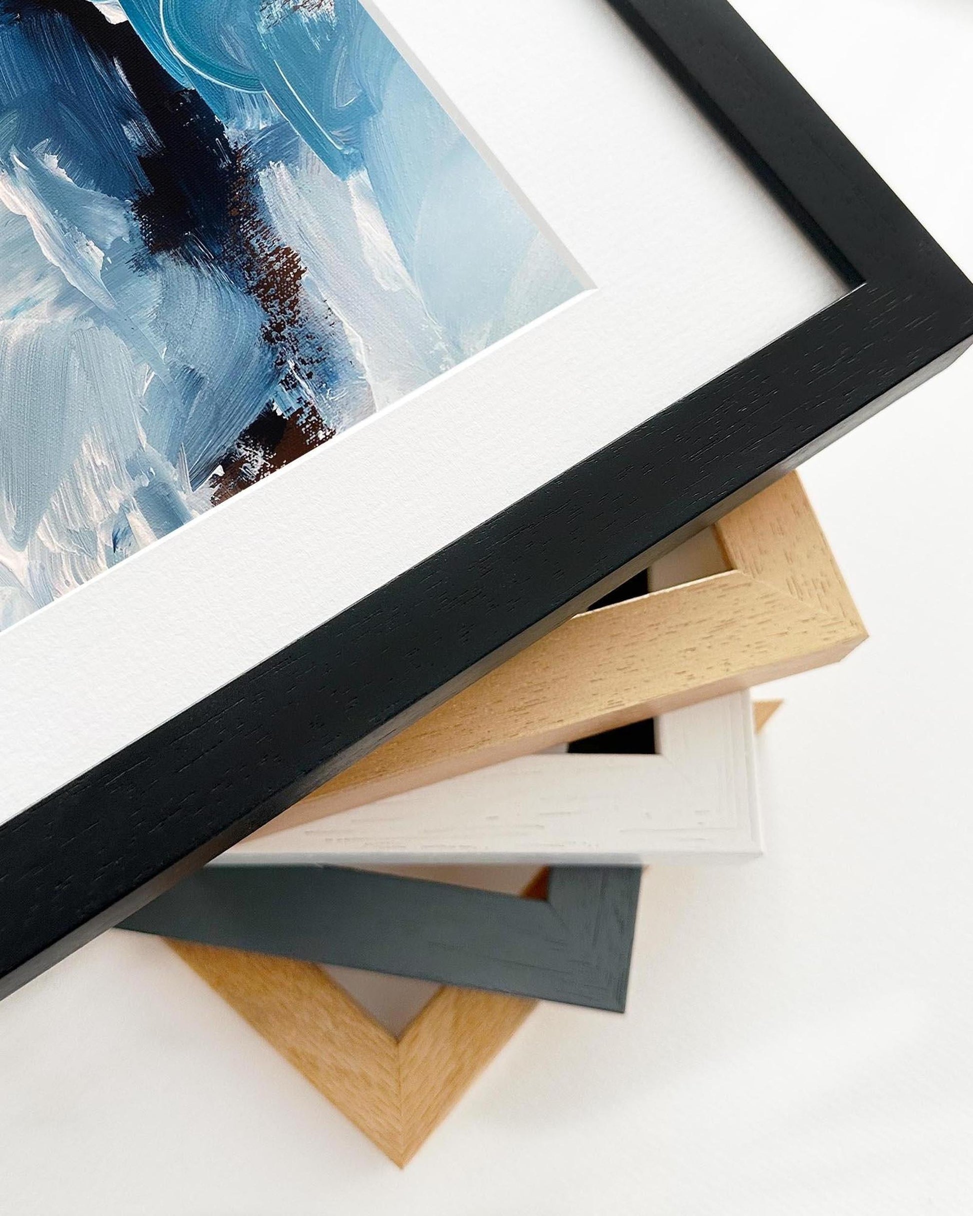 Collection of various photo frames on a white surface
