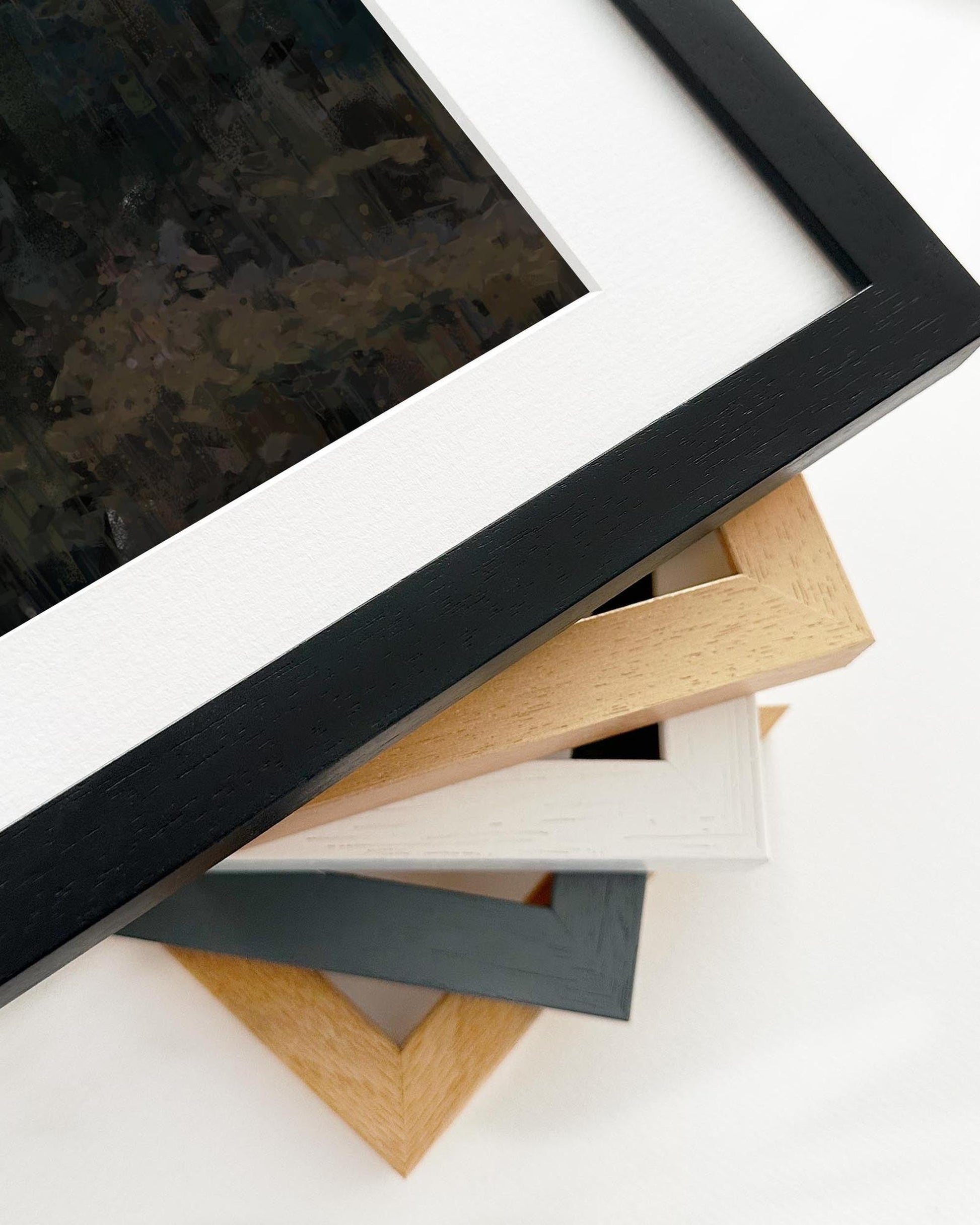 Collection of various photo frames in different colors on a white background