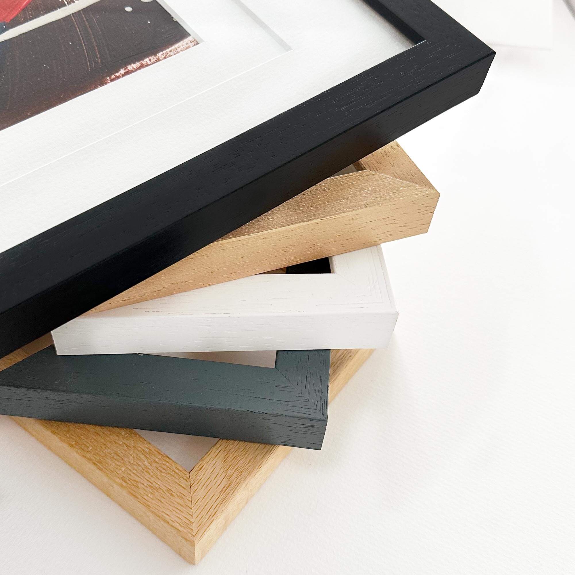 wooden frames in different colours for artwork 