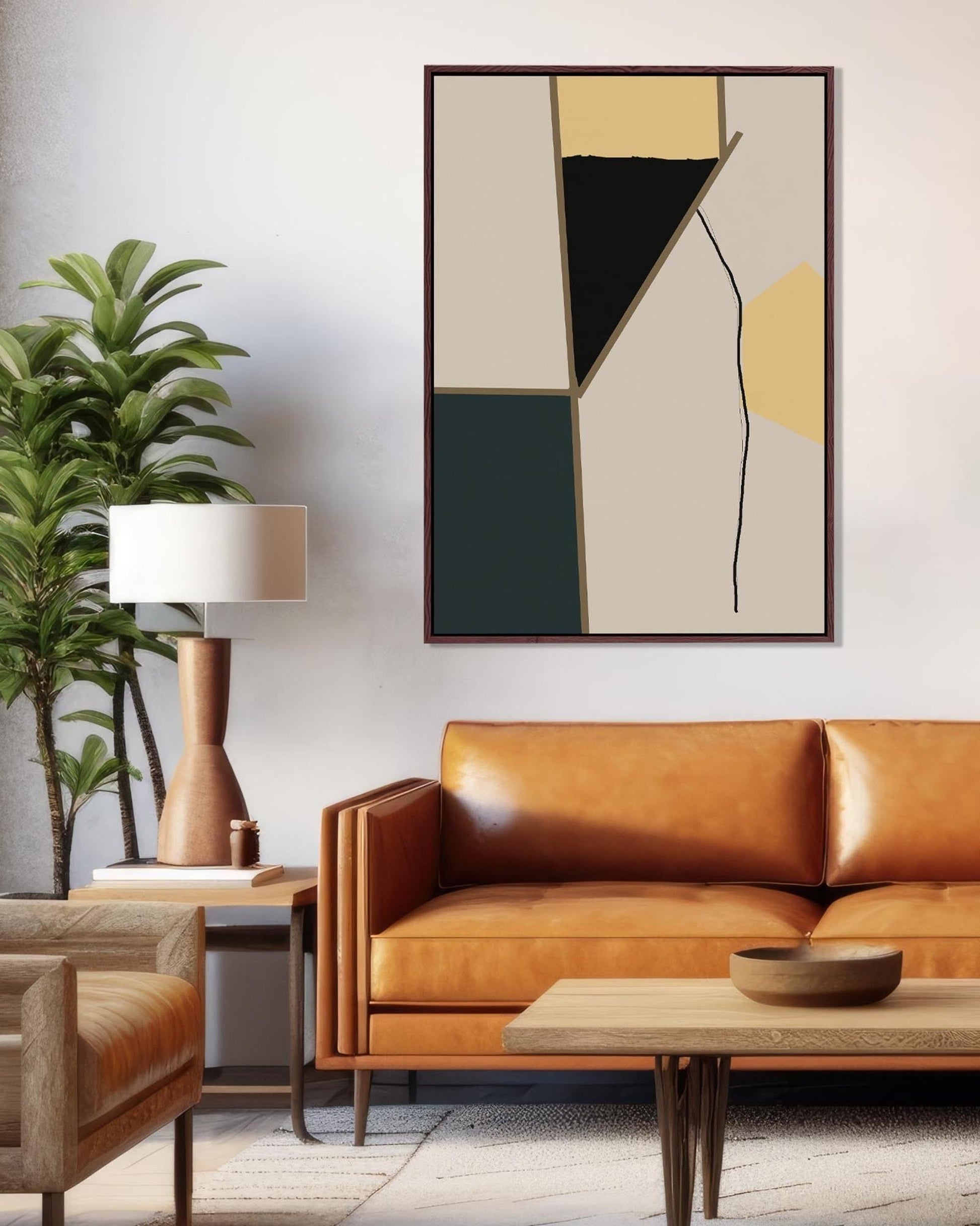 Modern living room with a brown leather sofa, abstract art, and a lamp.