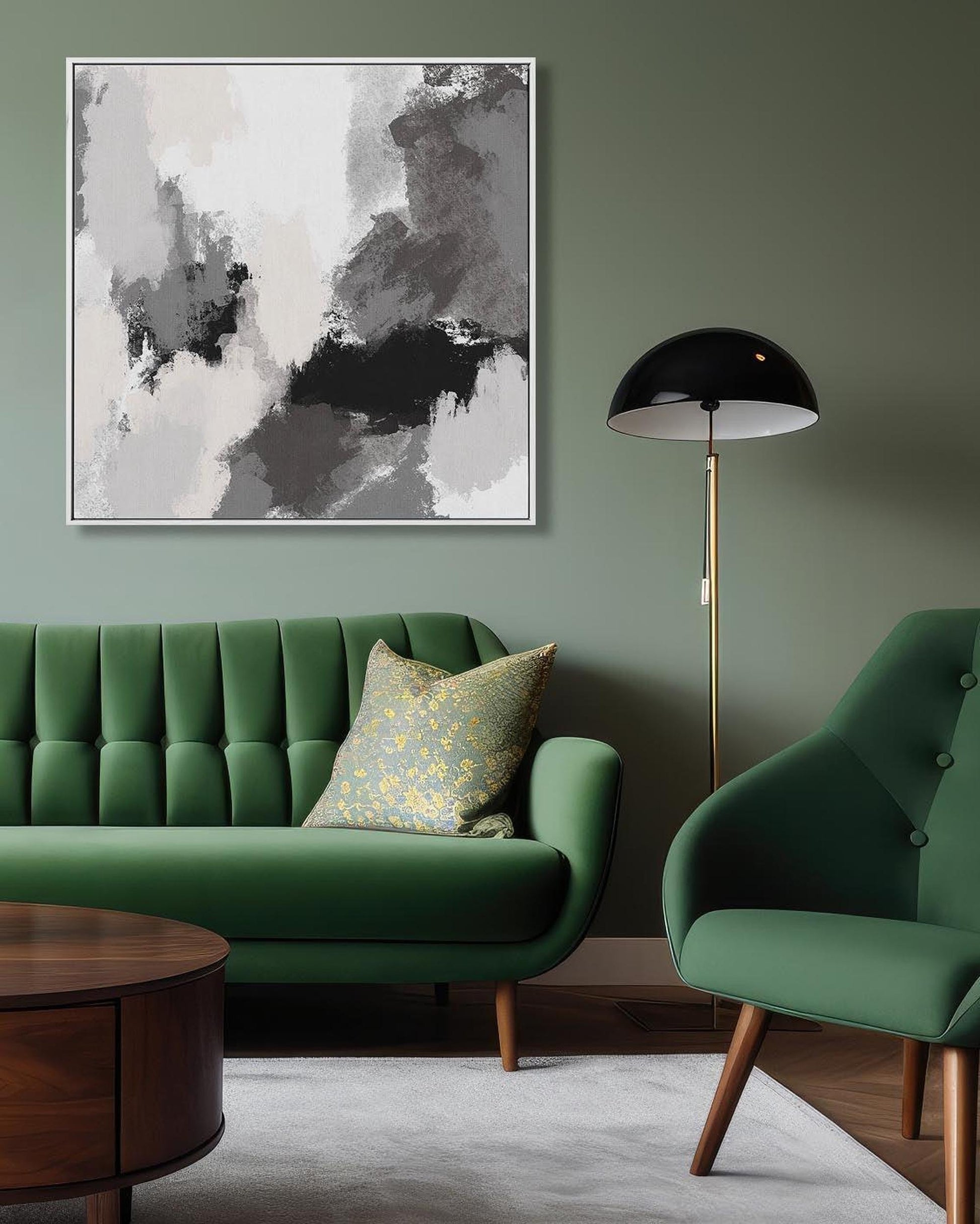 Modern living room with green sofa, armchair, and abstract art on a green wall.