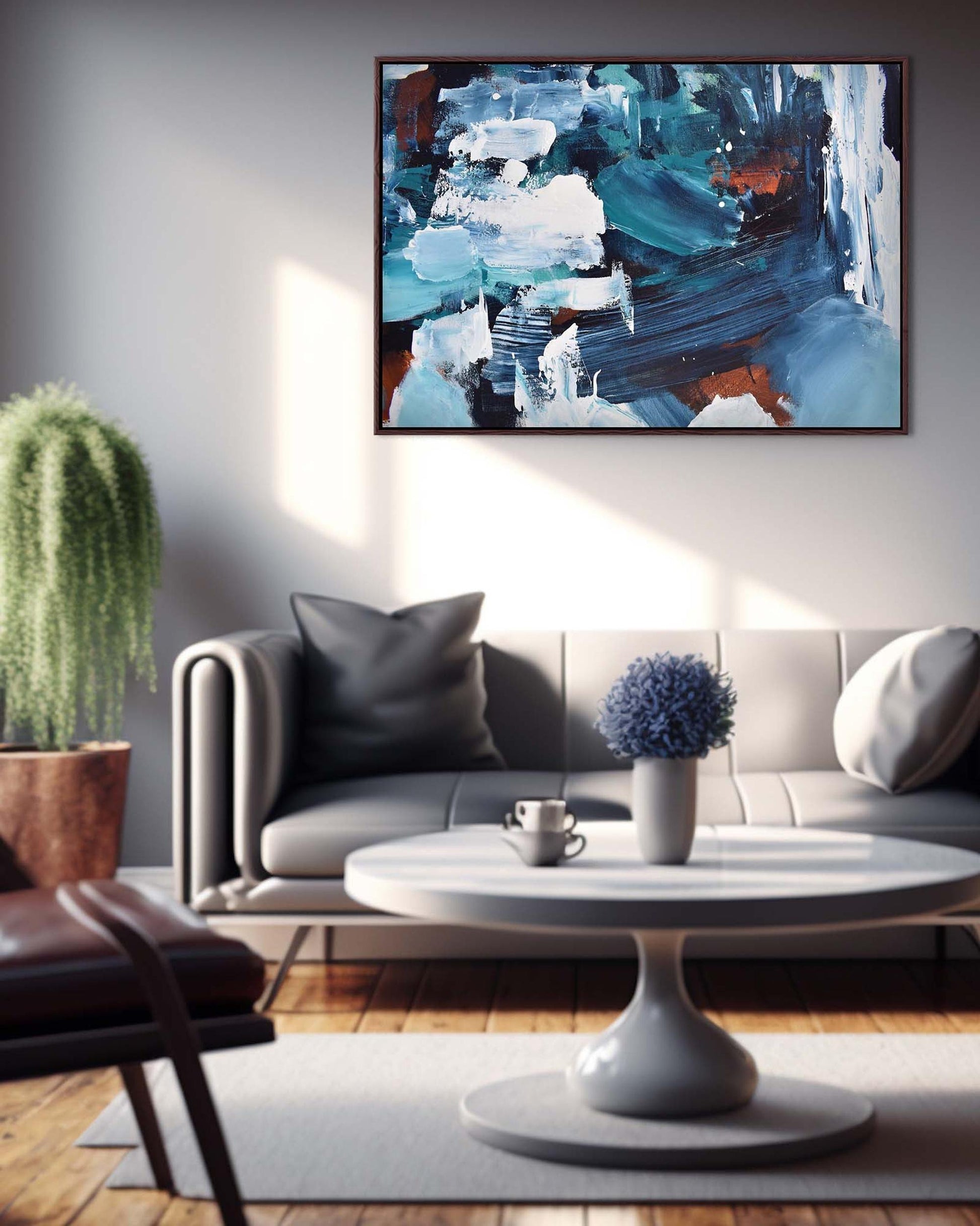 Modern living room with a gray sofa, abstract painting, and decorative items.