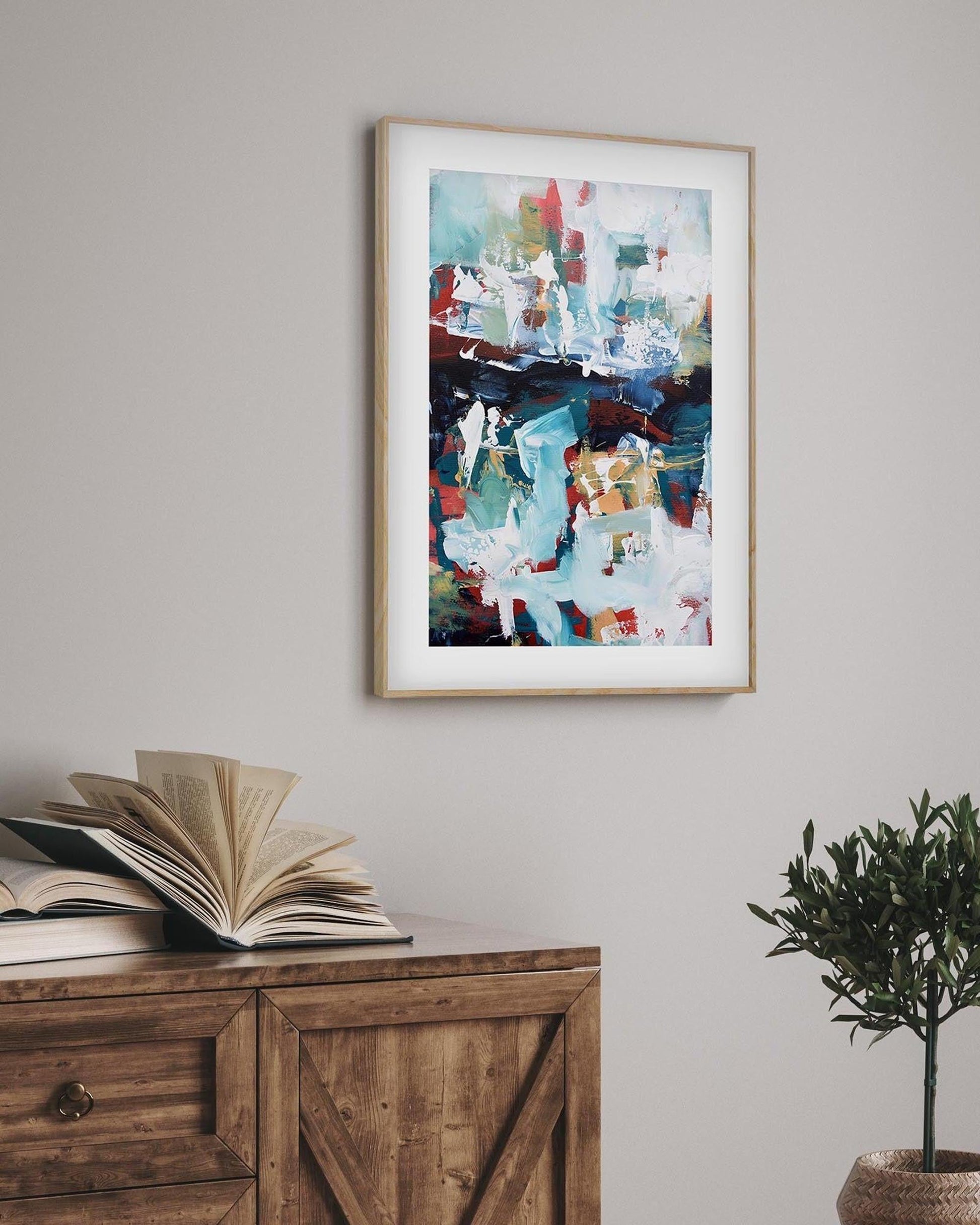 framed abstract poster in oak frame in a rustic living room