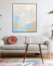 Living room with a gray sofa, wooden coffee table, and abstract art on the wall.