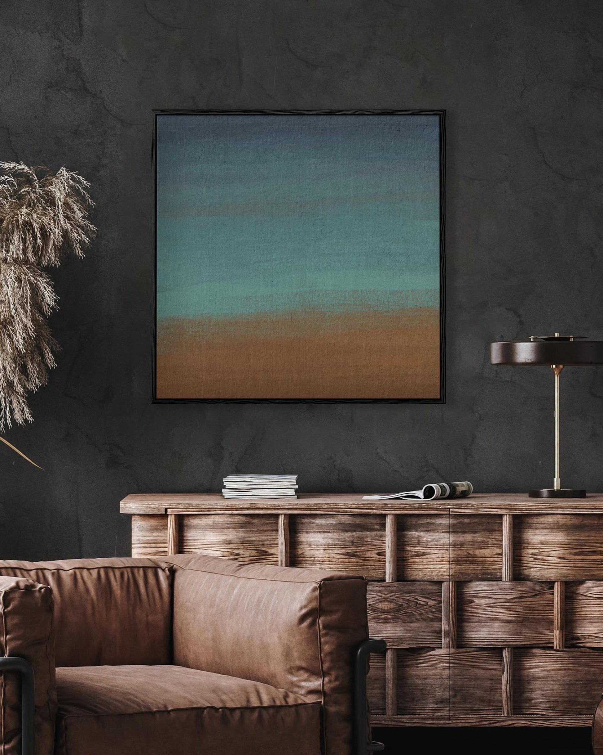 Living room with brown sofa, wooden console table, and abstract painting on dark wall.