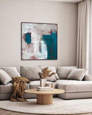 Modern living room with a gray sectional sofa, abstract painting, and wooden coffee table.