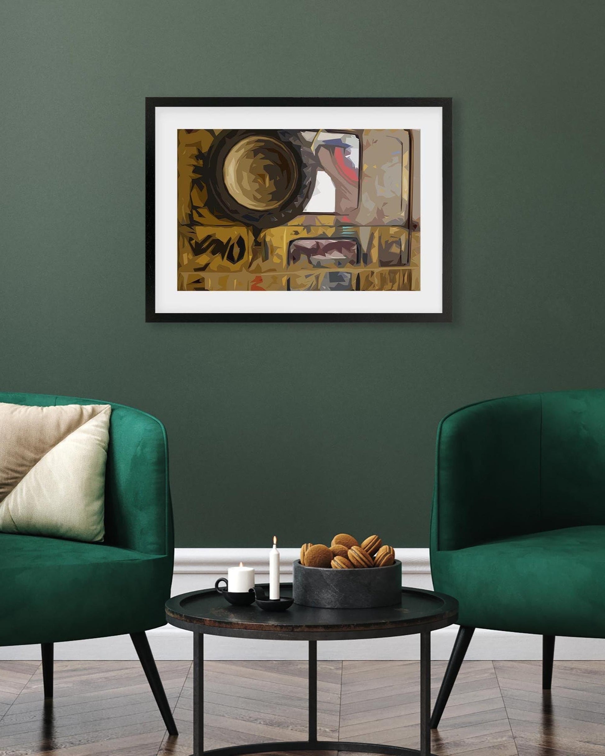 Two green chairs in a living room with a framed abstract painting on the wall.
