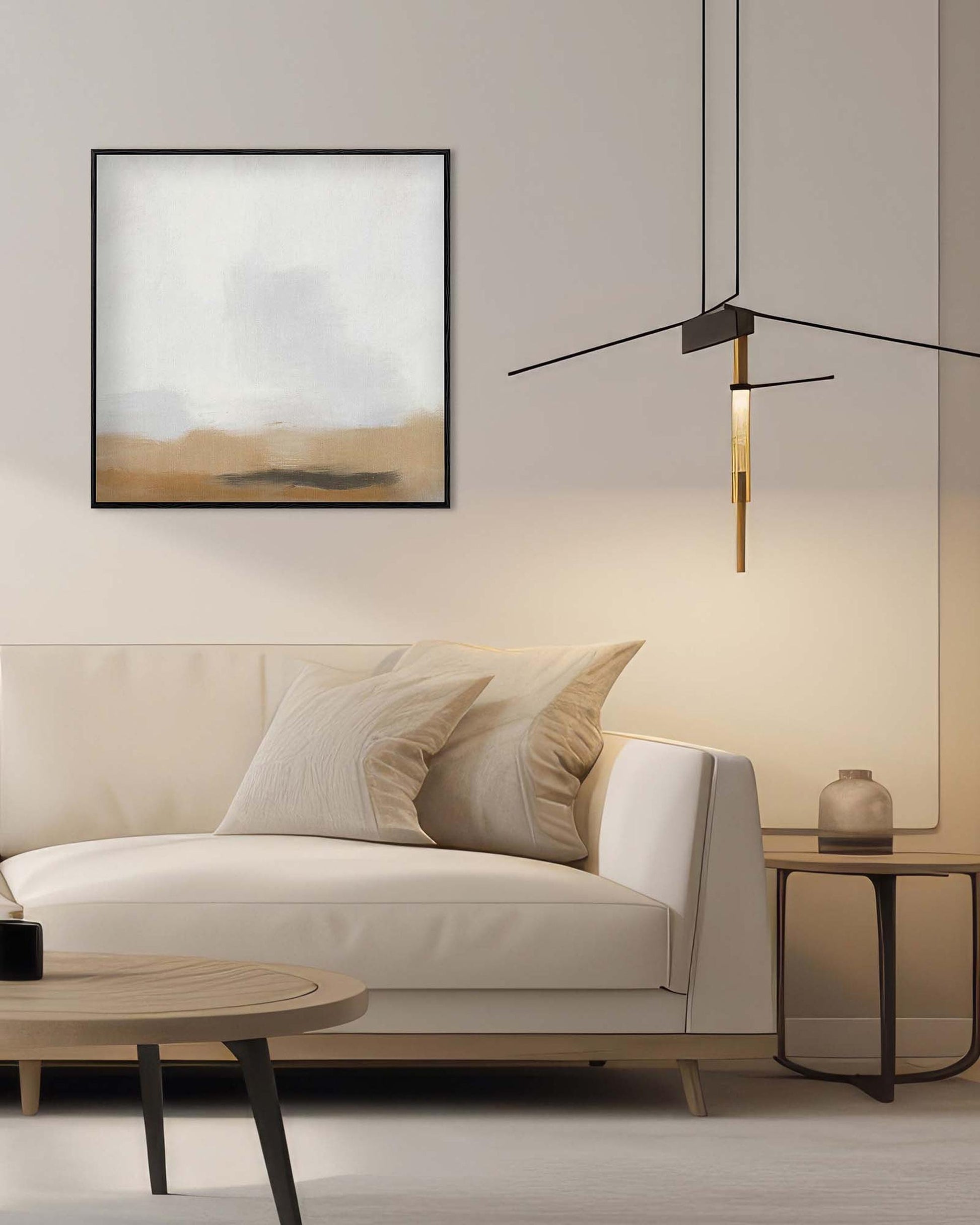 Modern living room with a beige sofa, abstract painting, and pendant light.