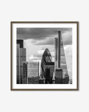 Framed black and white cityscape print featuring modern skyscrapers.