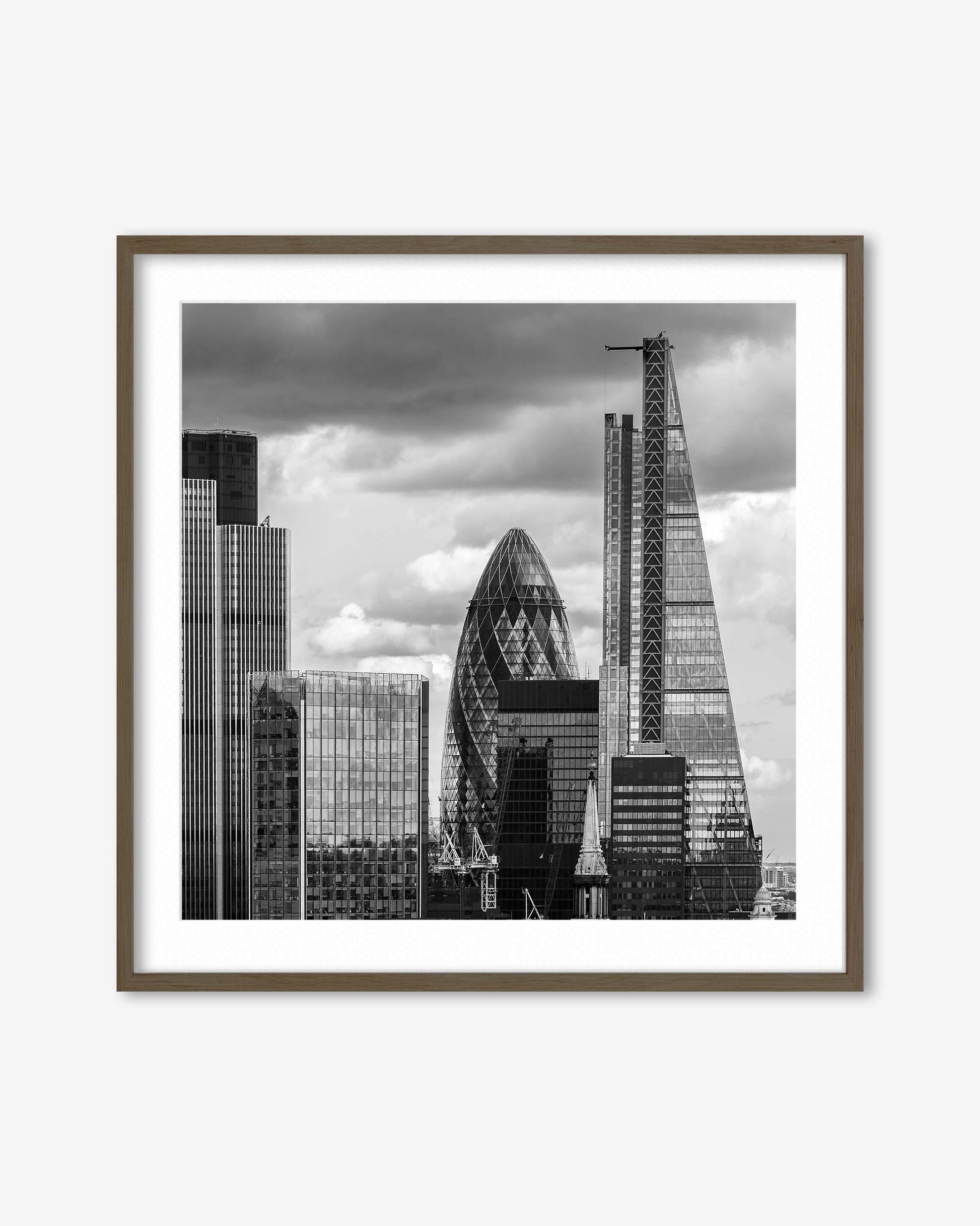 Framed black and white cityscape print featuring modern skyscrapers.