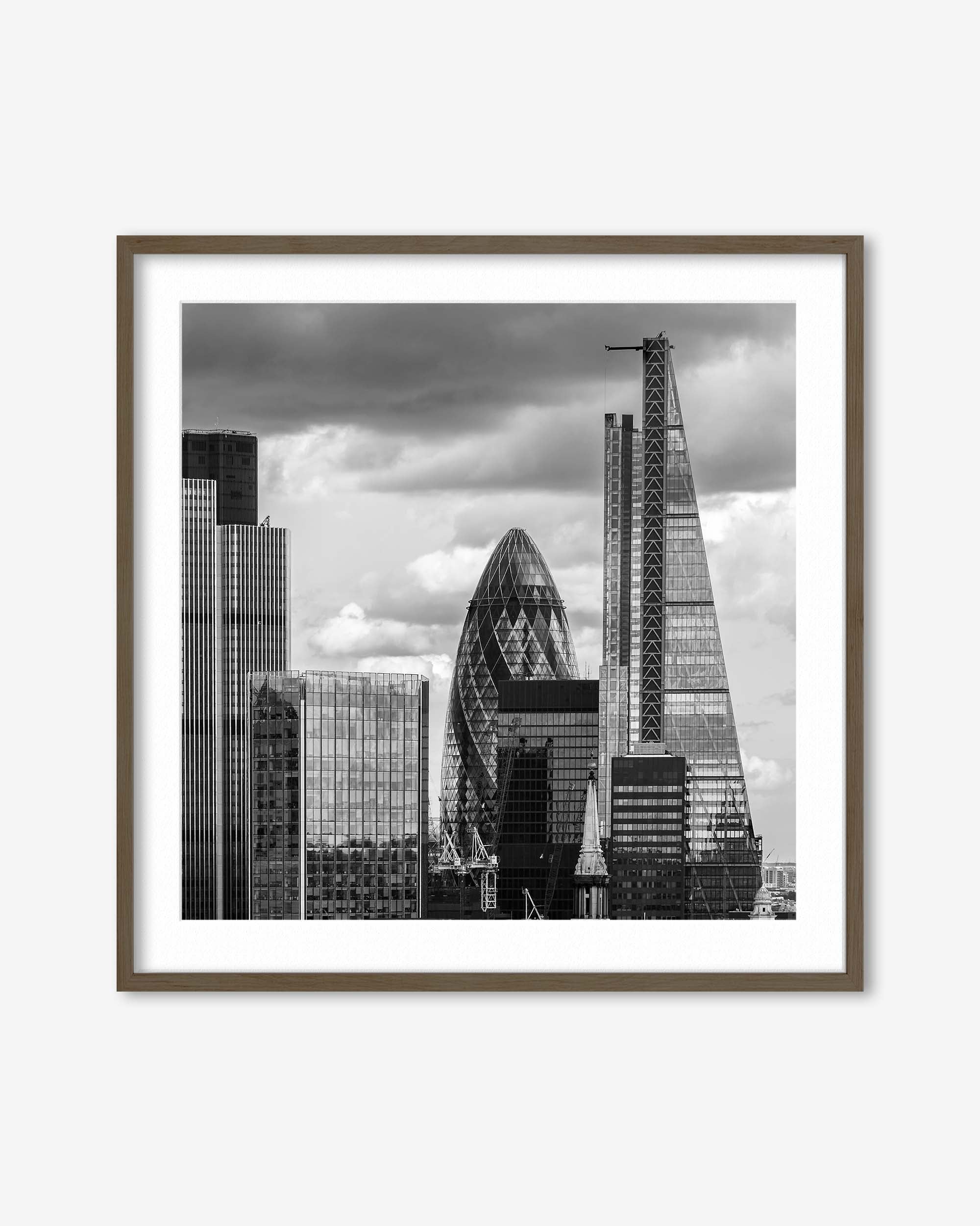 Framed black and white cityscape print featuring modern skyscrapers.
