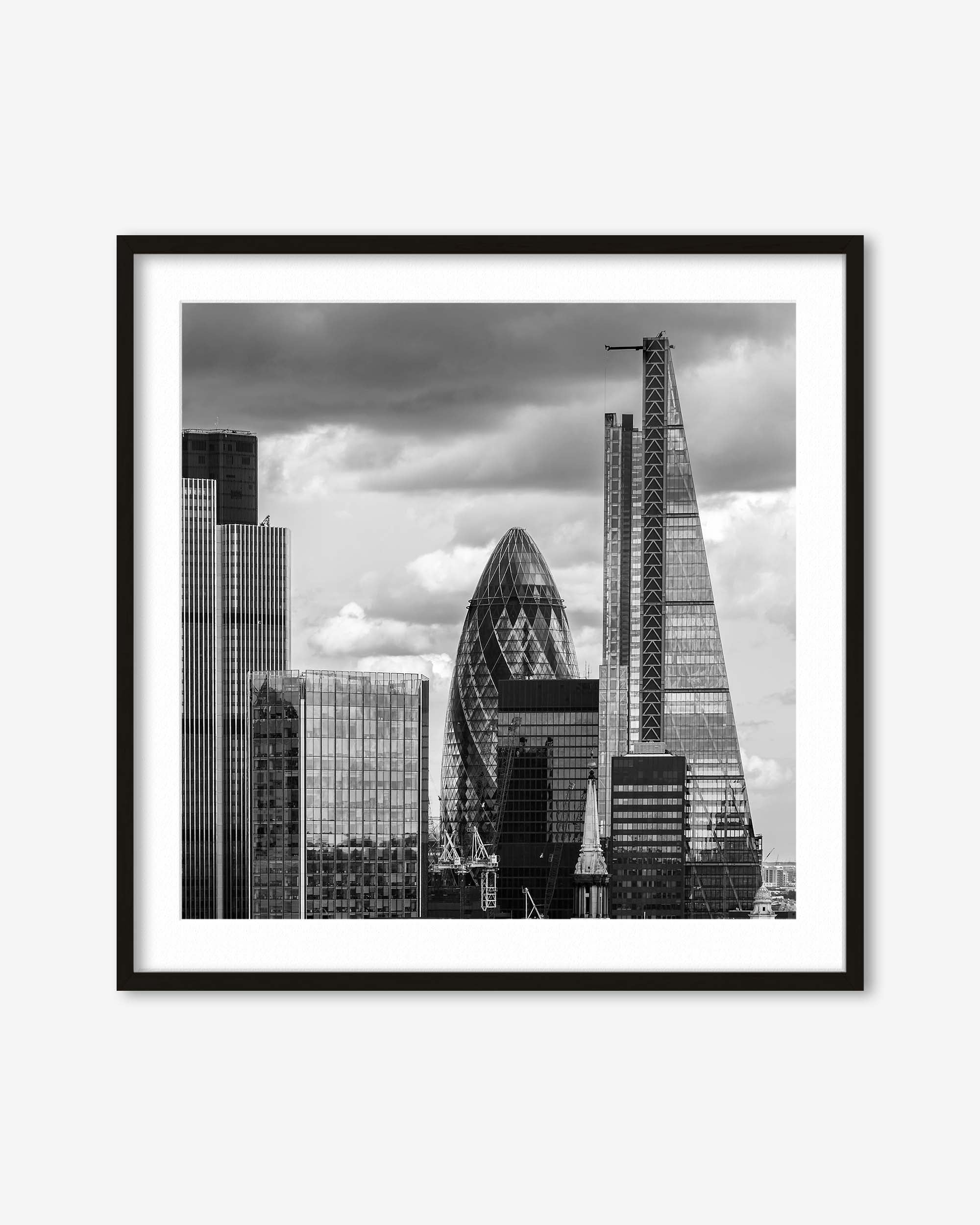 Framed black and white cityscape print featuring modern skyscrapers.