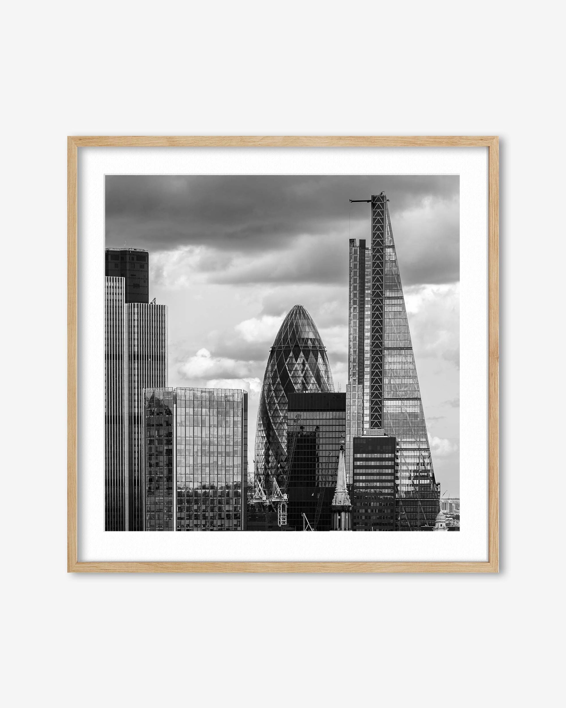 Framed black and white cityscape print featuring modern skyscrapers.