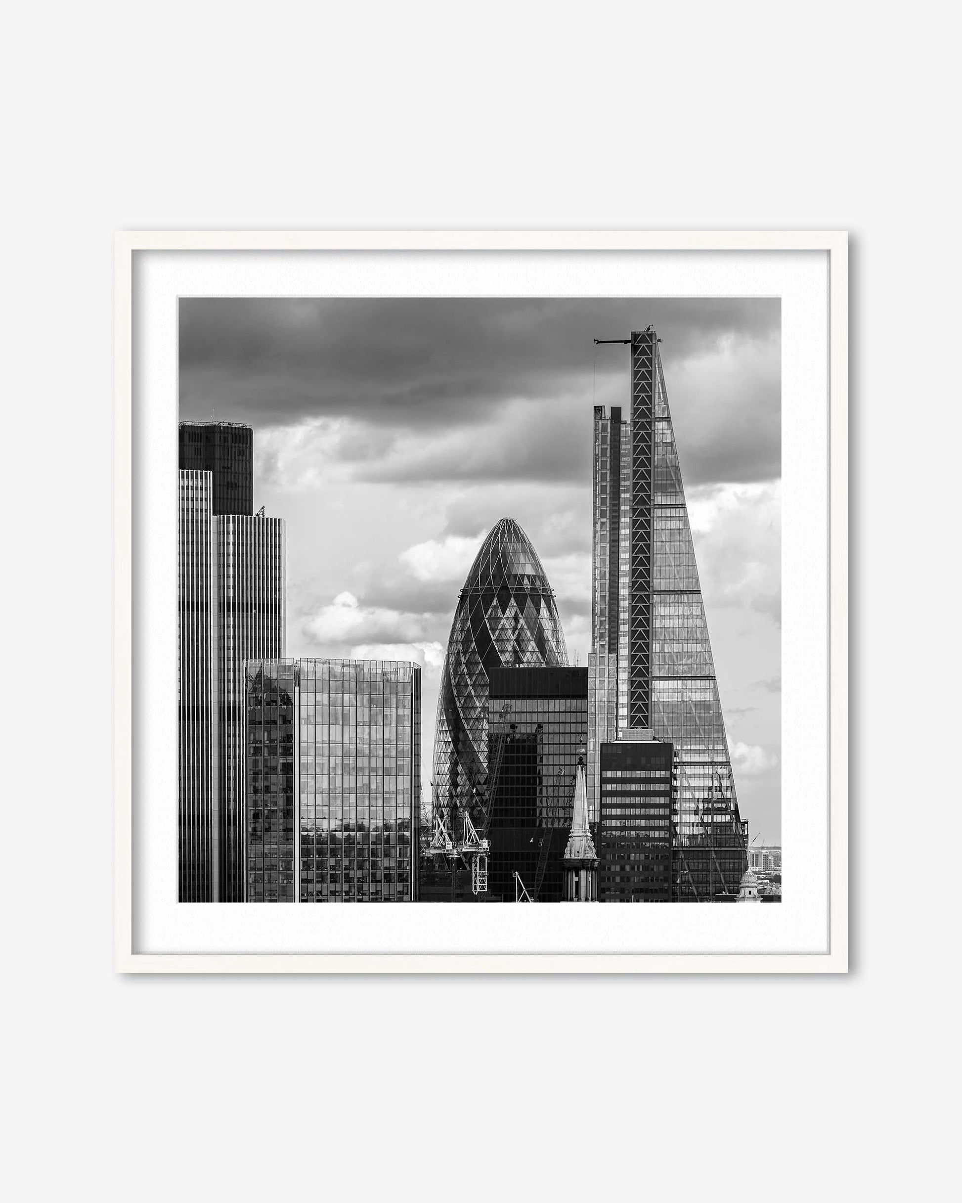 Framed black and white cityscape print featuring modern skyscrapers.