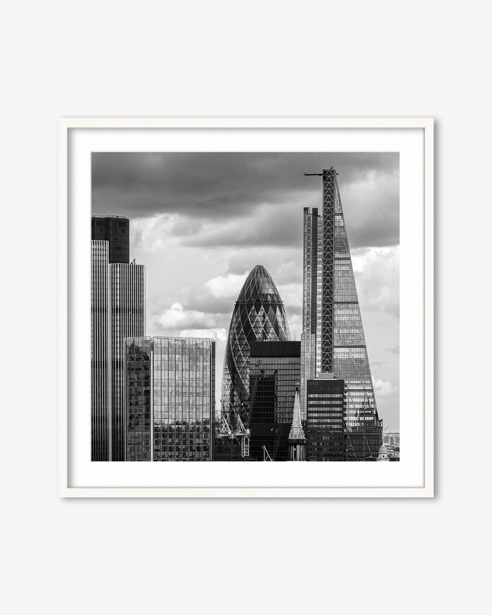 Framed black and white cityscape print featuring modern skyscrapers.