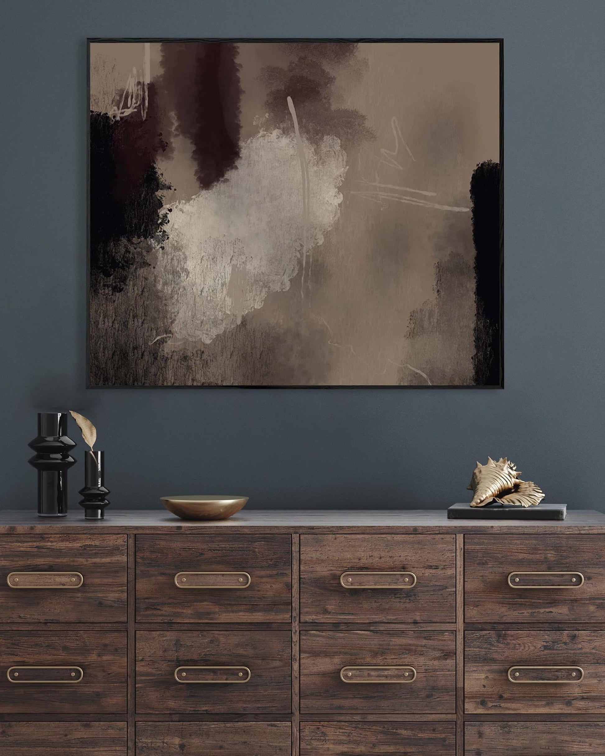 Abstract painting on a wall above a wooden dresser with decorative items.