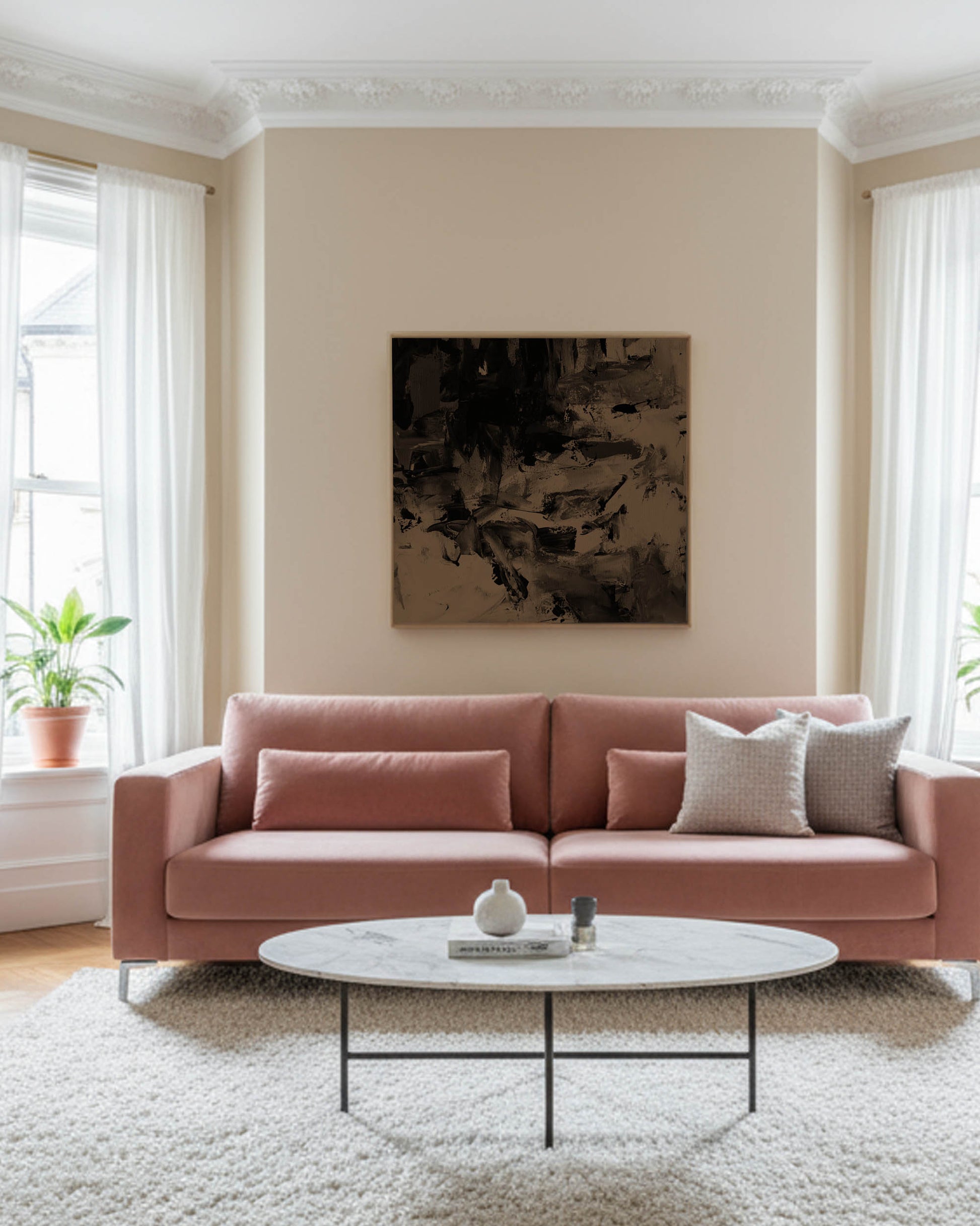 modern victorian apartment with high ceilings brown umber wall art painting on canvas with blush sofa and marble table