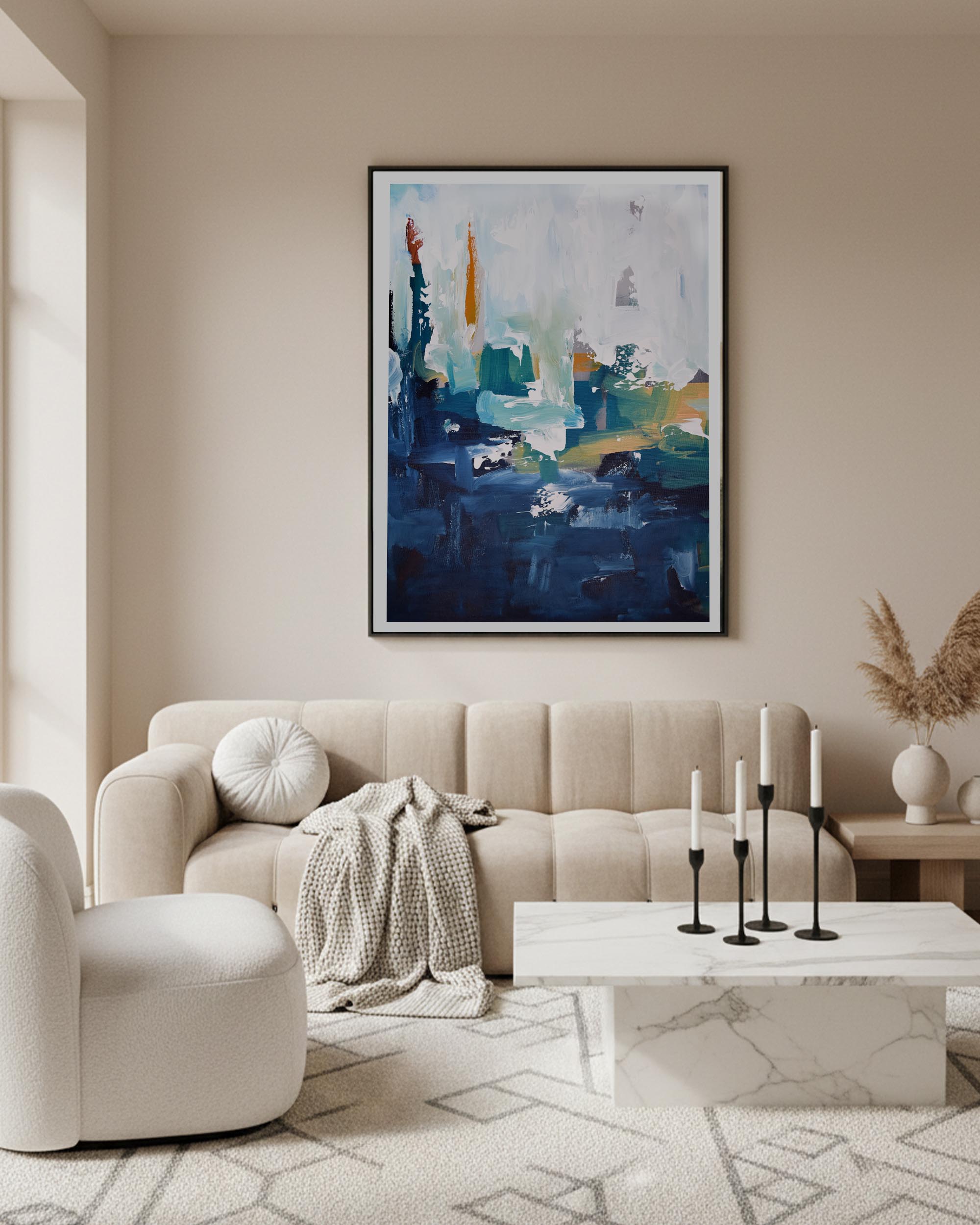 modern oversized abstract wall art in blue navy and white, above cream bubble sofa in large apartment, painted in Pantone Cloud Dancer with marble coffee table and candle sticks.