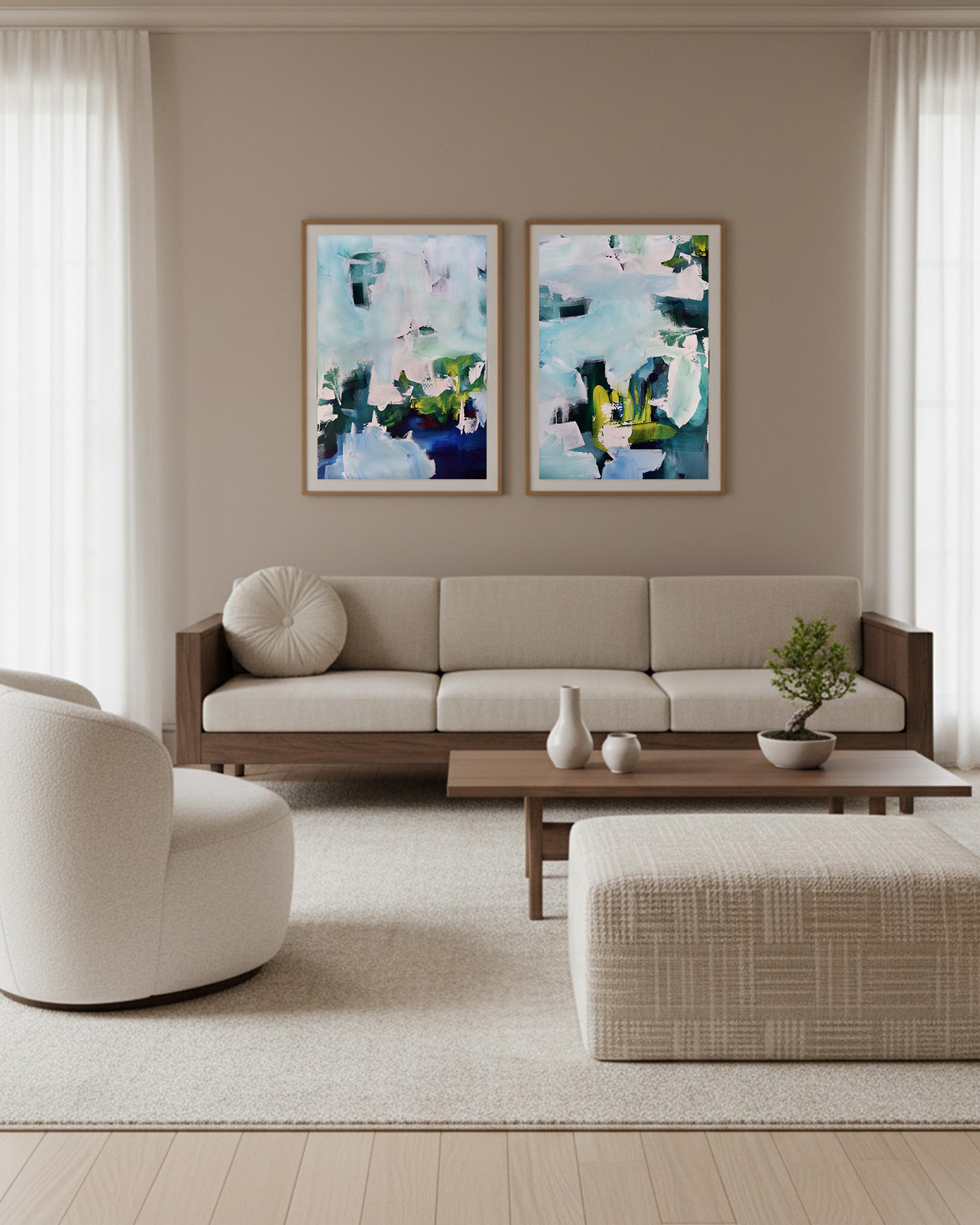 Modern living room with a beige sofa, armchair, and abstract art on the wall.