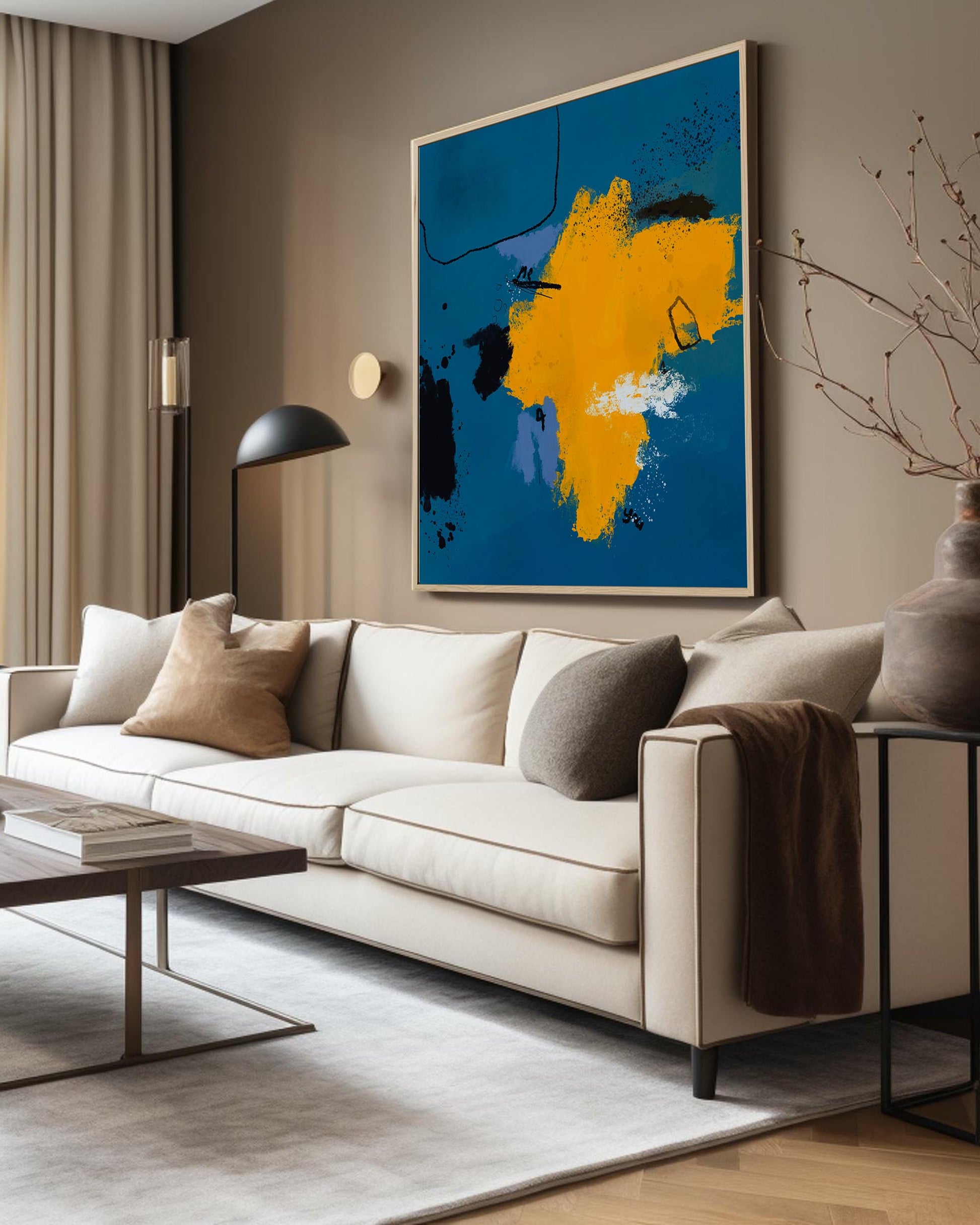 Living room with a large sofa, coffee table, and abstract art on the wall.