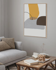 Modern living room with a gray sofa, wooden coffee table, and abstract art on the wall.