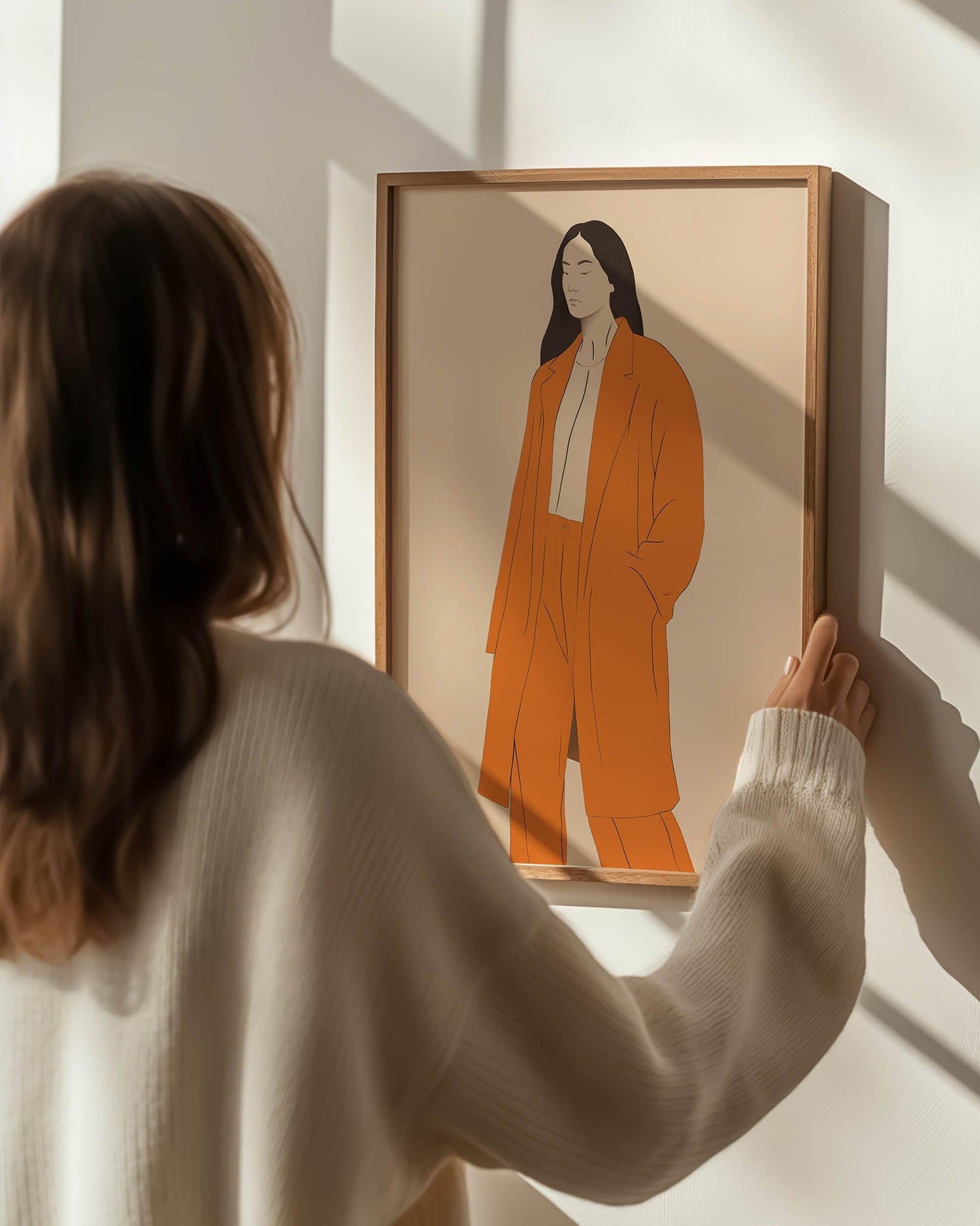 modern wall art poster affordable prints in oak frame scandinavian living room picture woman holding art on white wall