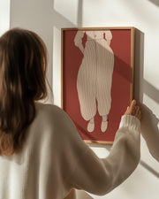 modern scandinavian poster print woman holding wall art picture on wall in frame