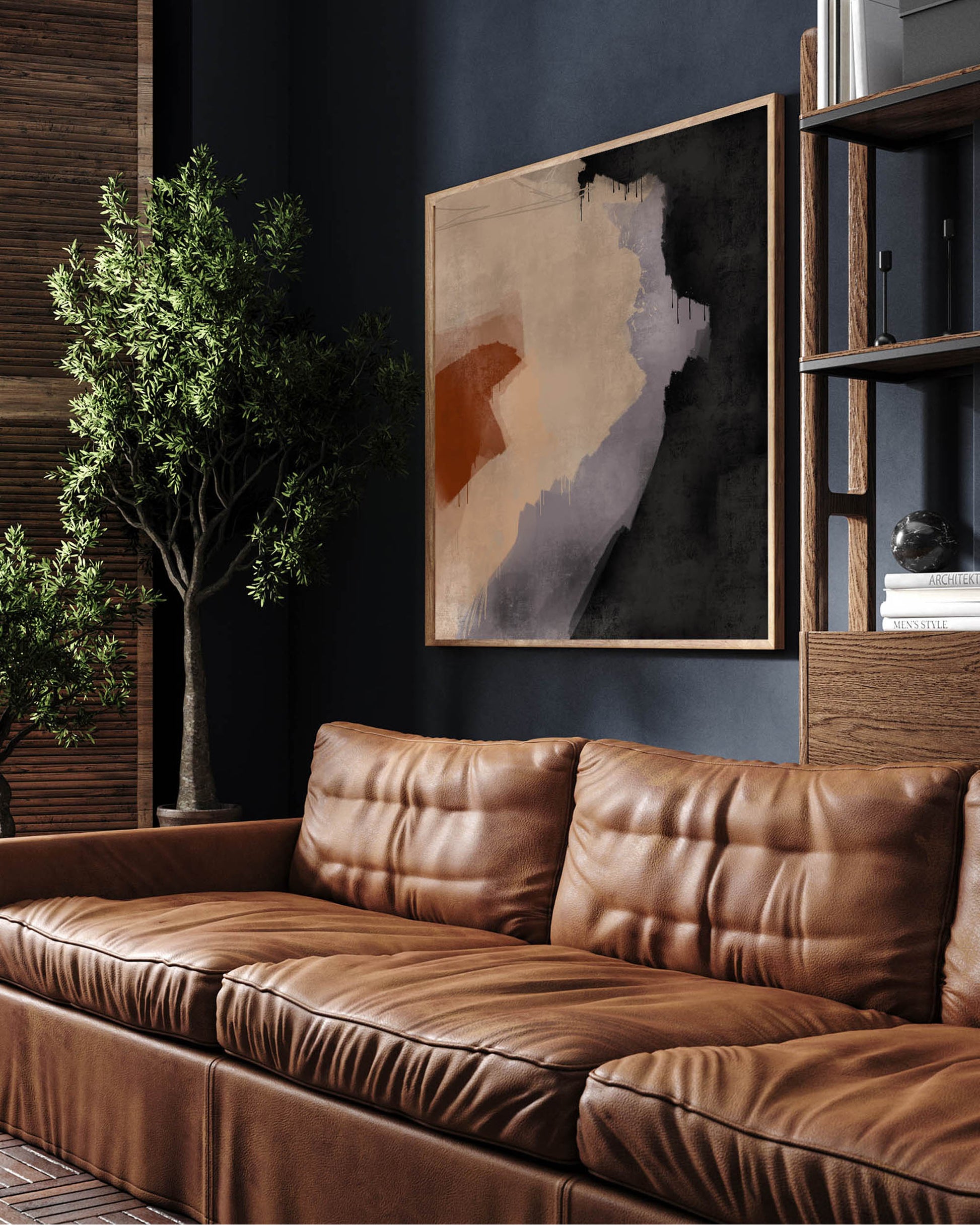 A modern abstract painting in black, grey, and terracotta tones, displayed above a brown leather sofa in a room with dark walls and a bookshelf.