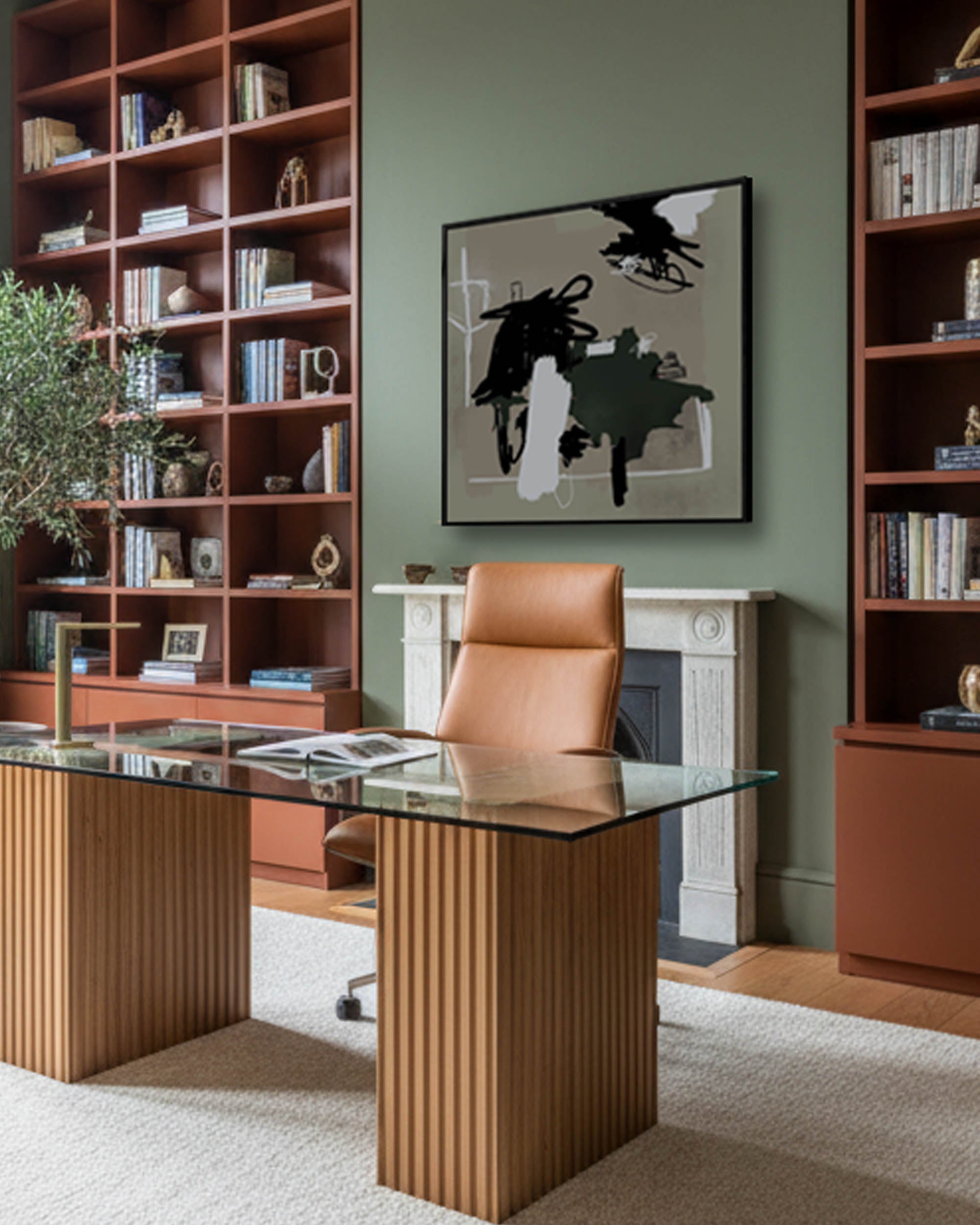 modern mid century home office with fitted bookcases modern joinery with large olive green abstract canvas wall art on wall.