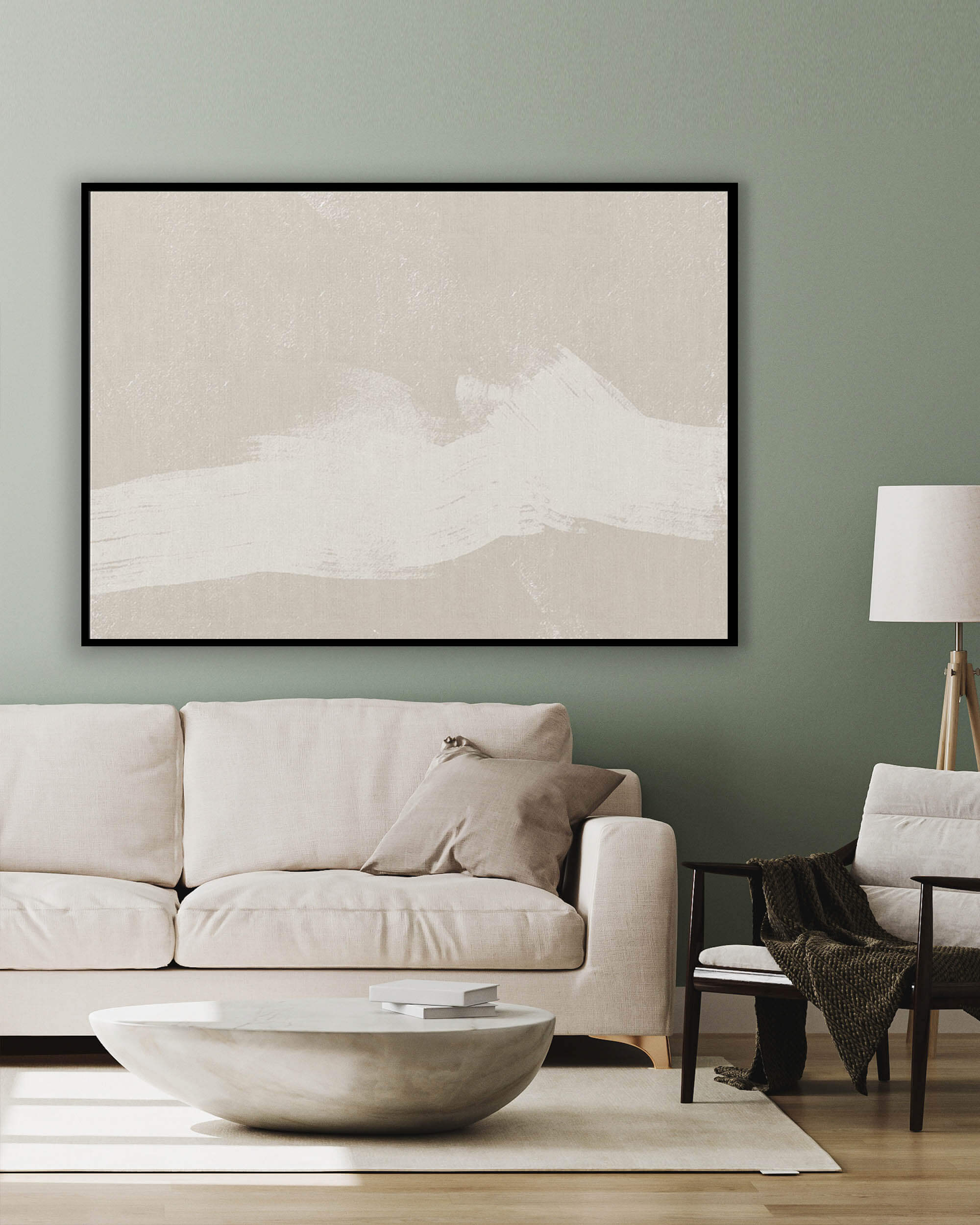 large beige neutral wall art on canvas above sofa in contemporary living room with side chair and lamp